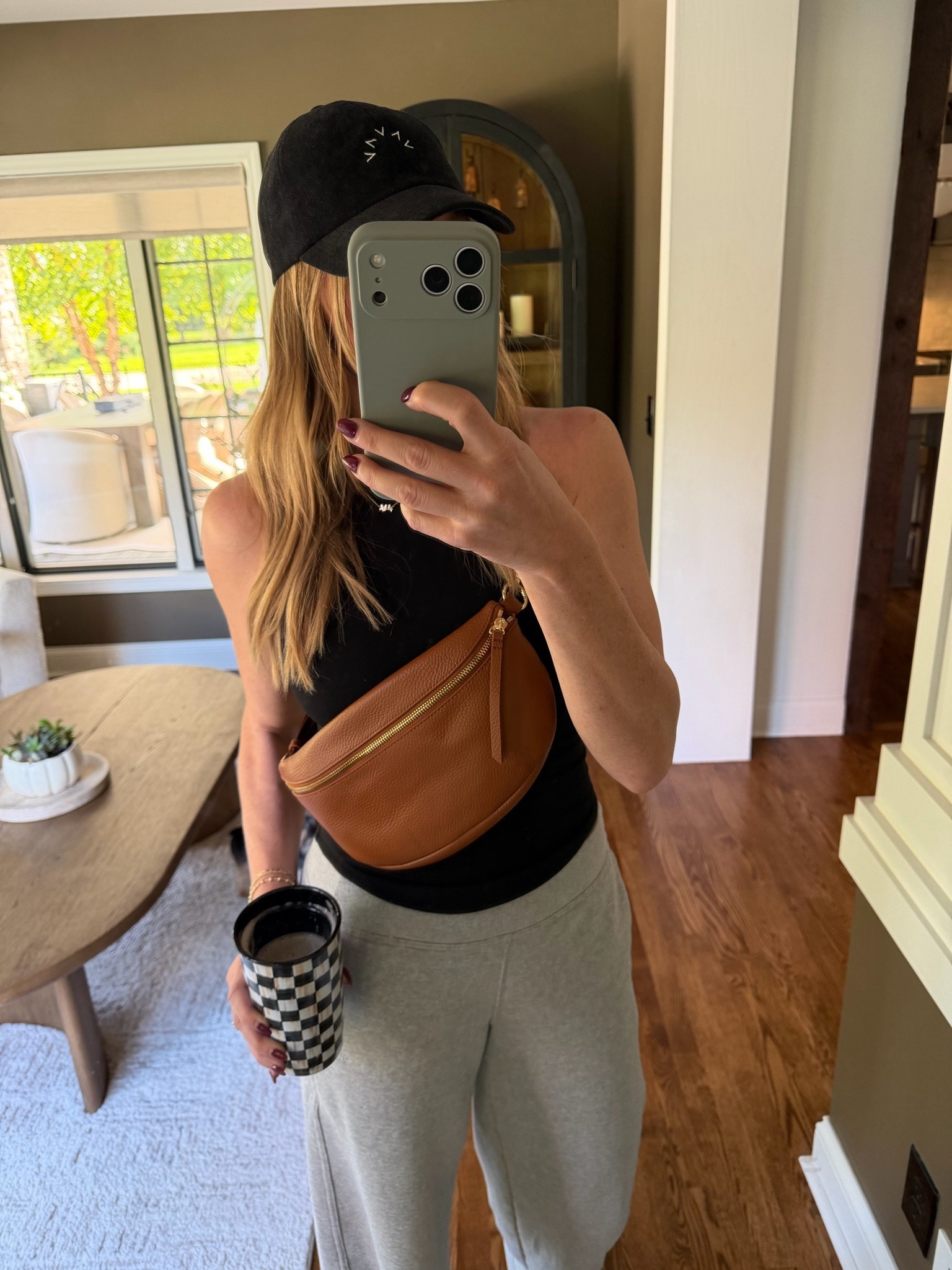 The sling bag!! Just went on sale! It’s the softest leathered and is a larger size with a front and bag zipper