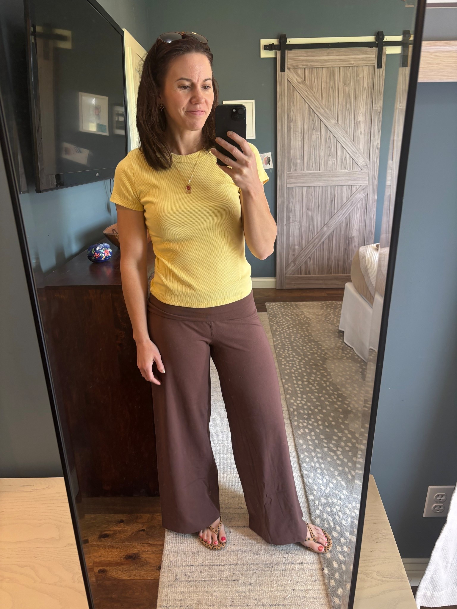 Easy outfit I keep reaching for 🤎

Soft yellow tee + flowy brown wide-leg pants = no thinking required, still looks pulled together. Lightweight, comfortable, and works for everyday errands or being at home.

• tee: fitted, soft stretch (true to size)
• pants: wide-leg, elastic waist, breathable (runs relaxed)
• sandals: easy slip-on neutral

Everything linked—these are the pieces I actually wear on repeat. 

#LTKmomlife #LTKdayinmylife #LTKOver40