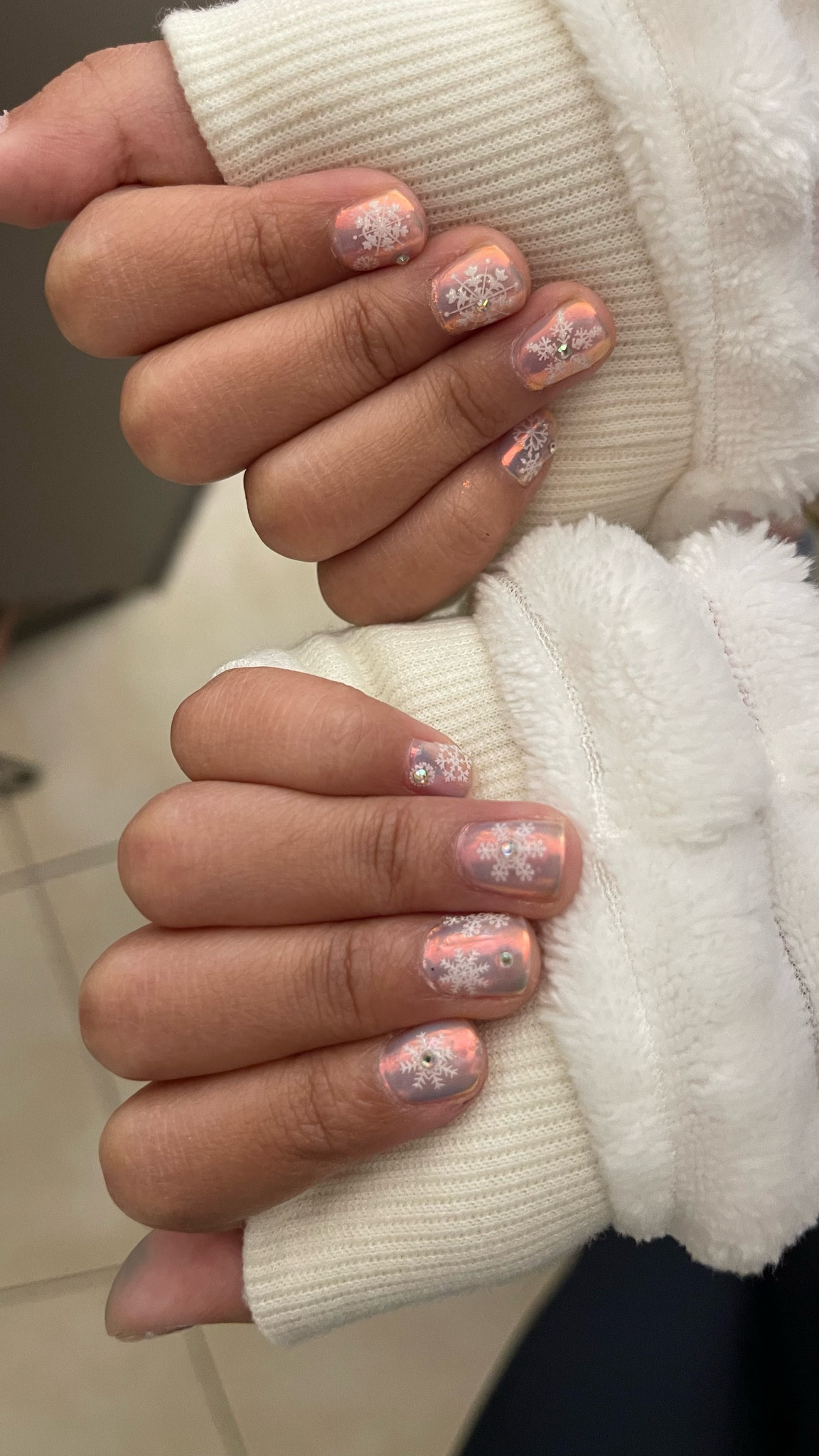 Chrome gel nail polish with snowflake nail art stickers for my daughter’s winter break nails. ❄️ 💅🏽 

I used gel base coat and a no wipe top coat to apply the iridescent chameleon chrome special effects nail lacquer.  

#LTKBeauty #LTKFindsUnder50