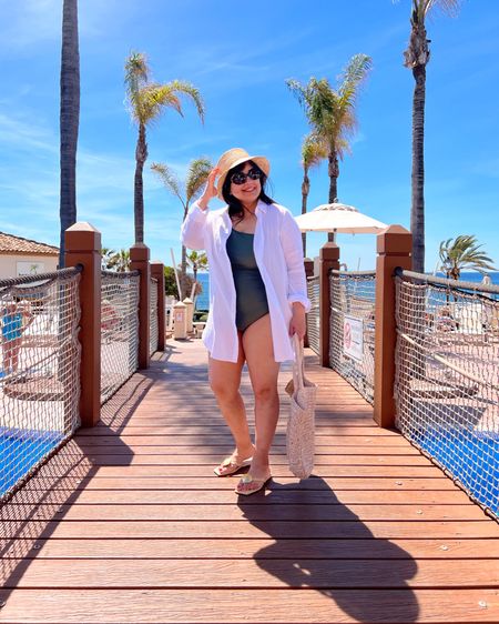 J. Crew sleek ruched one shoulder one-piece swimsuit on sale for under $50 (reg $118)! Wearing here in size 10. J. Crew Factory swim coverup size large also on sale. J. Crew raffia bucket hat. Katy Perry shell raffia sandals true to size on sale too. J. Crew Factory raffia bag. Celine sunglasses.

Beachwear, swimsuit, summer outfit, vacation outfit, pool attire, vacation outfit ideas, resort wear, resort style, vacation style, bathing suit, curvy swimwear, swim style, island outfit, mid size style, spring break outfit, summer outfits, strapless bathing suit, one shoulder swimsuit

#LTKMidsize #LTKSwim #LTKSaleAlert