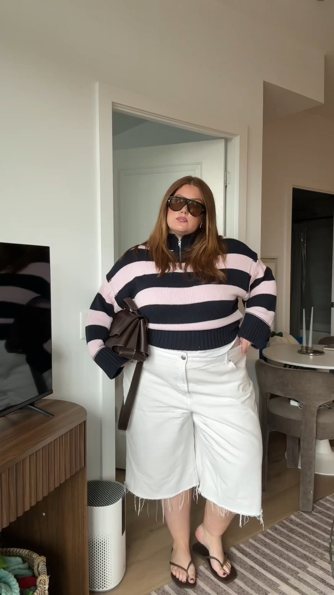 Plus size transitional fall outfit idea using the J.crew stripped tiny rollneck sweater with a quarter zip neckline and white cut off jorts

#LTKplussize #LTKfall #LTKmidsize