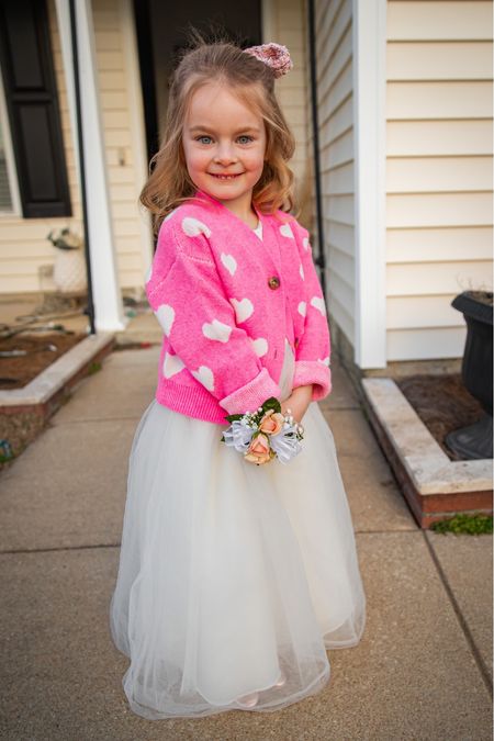 Little girl’s Valentine’s Day Style . This cardigan is so soft she wears it all the time! Match it with a tulle dress and it’s the most darling Valentine’s Day party outfit. She wore this to her first daddy daughter dance.  Kids cardigan | heart cardigan | 5T Clothing | Toddler Girl Style | tulle maxi dress #kidsclothing #valentinesdaystyle #toddlergirlstyle #toddlercardigan 

#LTKkids #LTKSeasonal #LTKfamily