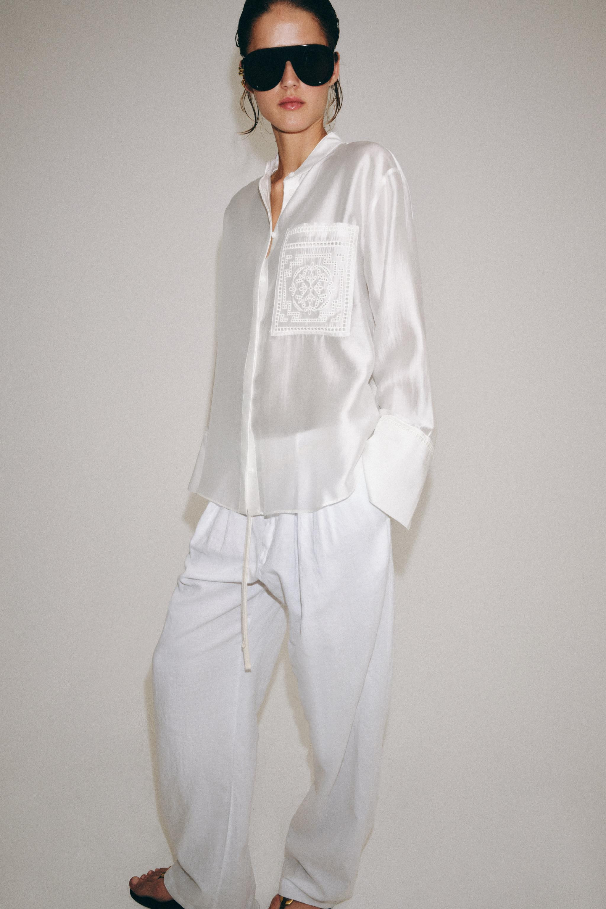 ZARA WOMAN COLLECTIONRound neck long sleeve shirt with cuffs. Patch pocket at chest. Tonal embroi... | Zara US