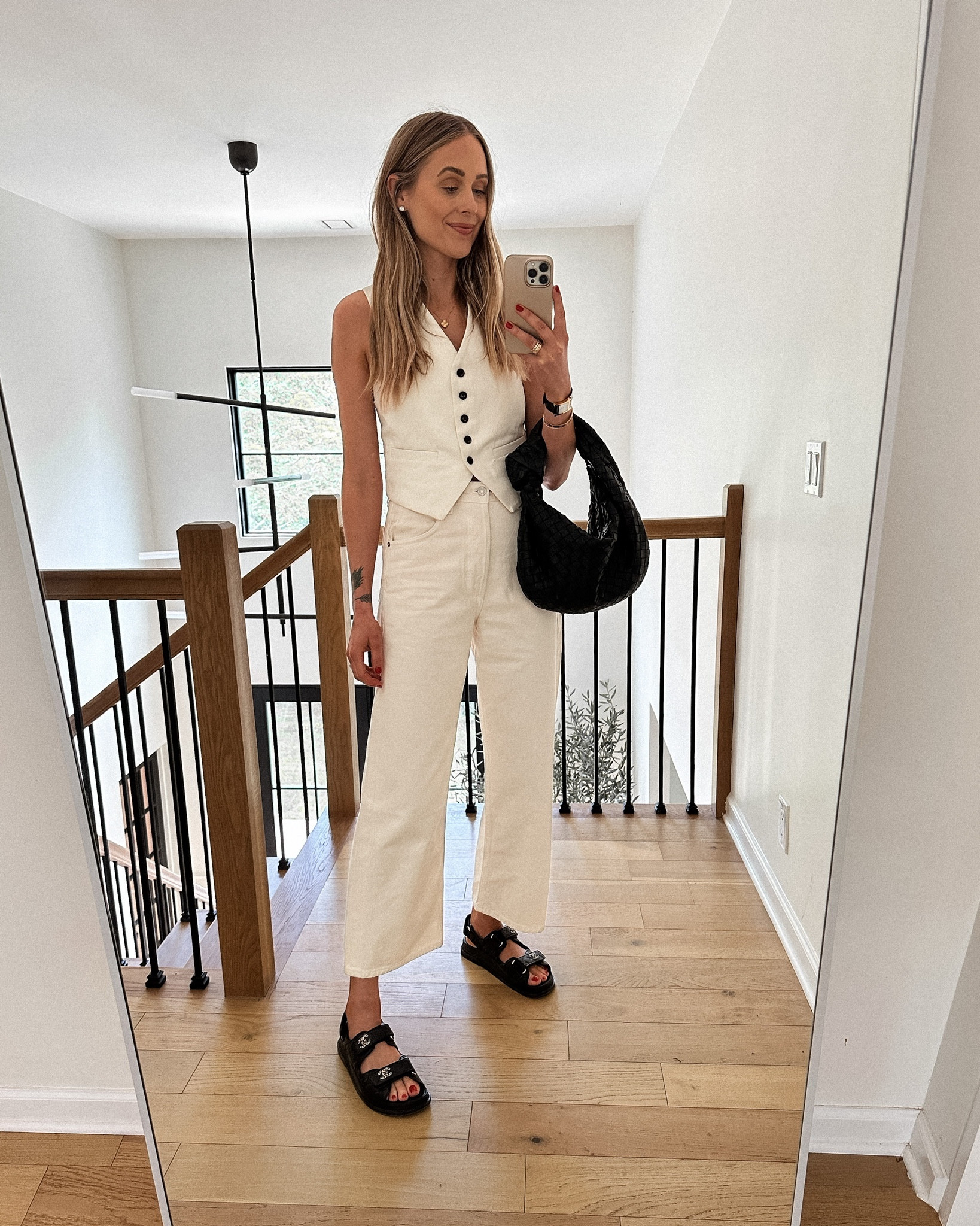 Fashion Jackson wearing white vest (xs) white jeans (tts) black dad sandals (linked similar) black bottega handbag 

#LTKstyletip #LTKshoecrush #LTKunder100