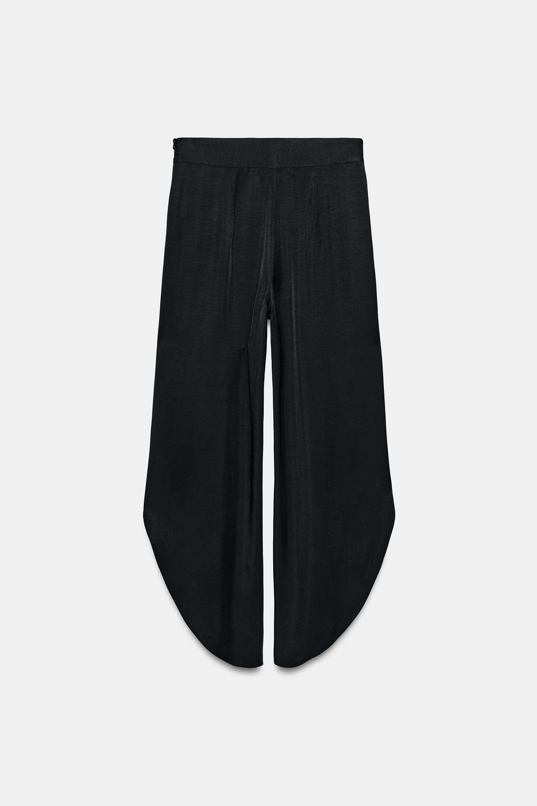 ZARA WOMAN COLLECTIONMid-rise pants made from viscose yarn. Front pleats. Wide leg. Side vents at... | Zara US