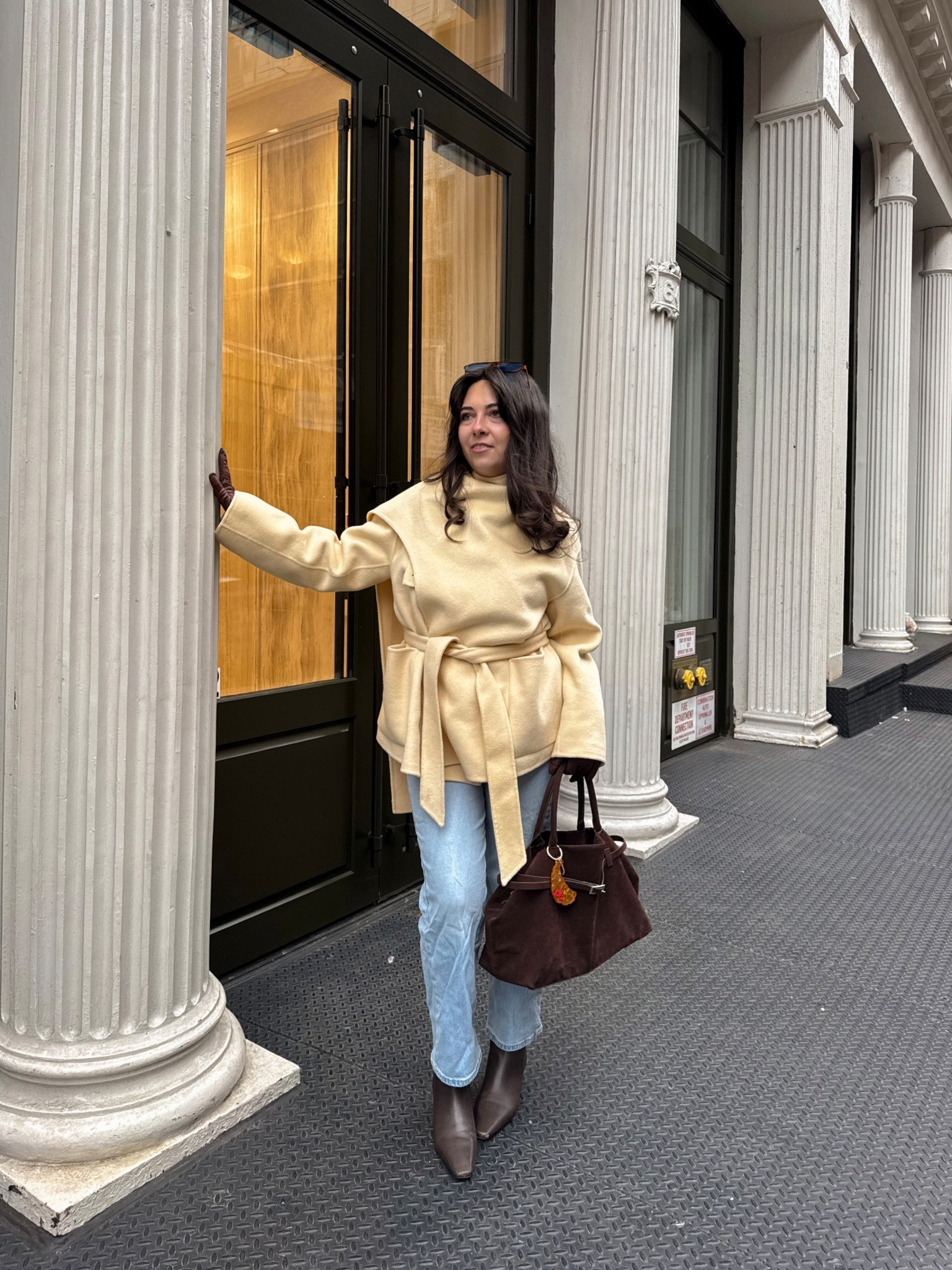  classic winter outfit idea I keep reaching for in NYC. This neutral wrap jacket outfit is perfect for cold city days — polished, warm, and easy to rewear. Styled with light-wash straight leg jeans, brown leather ankle boots, leather gloves, and a structured brown suede handbag for an elevated everyday look. A great casual winter outfit for walking around the city, coffee runs, or weekend plans.

Sizing details:
– Wrap jacket: size XS
– Straight leg jeans: size 26
– Brown ankle boots: size 6

#LTKdayinmylife #LTKootd #LTKSeasonal