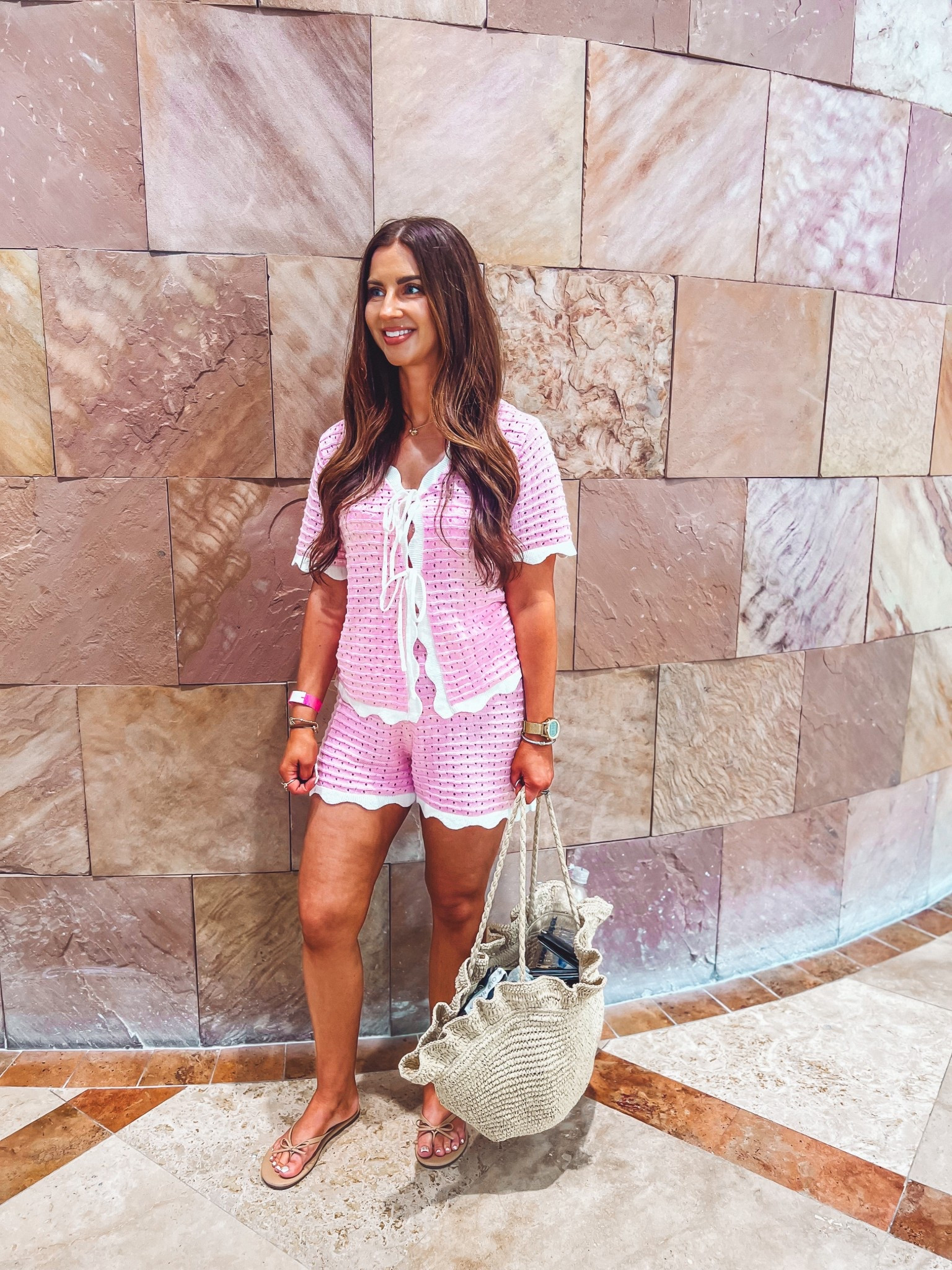 Pink and white scalloped crochet shorts set
Rattan ruffle bag 
Beige bow sandals