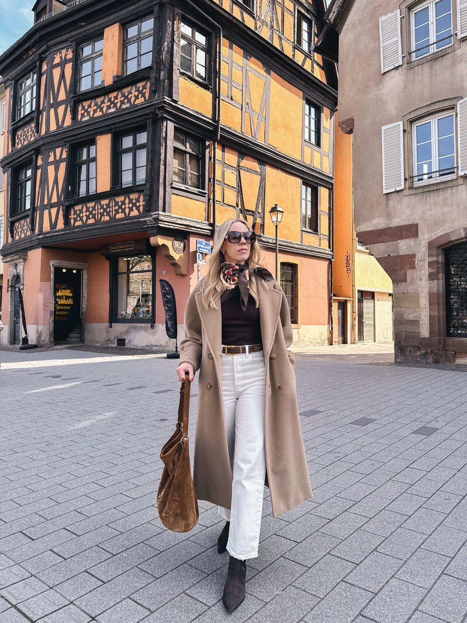 Spring travel look, white jeans with boots, Levi’s white ankle jeans, silk scarf outfit, chic travel style 

#LTKSeasonal #LTKOver40 #LTKTravel