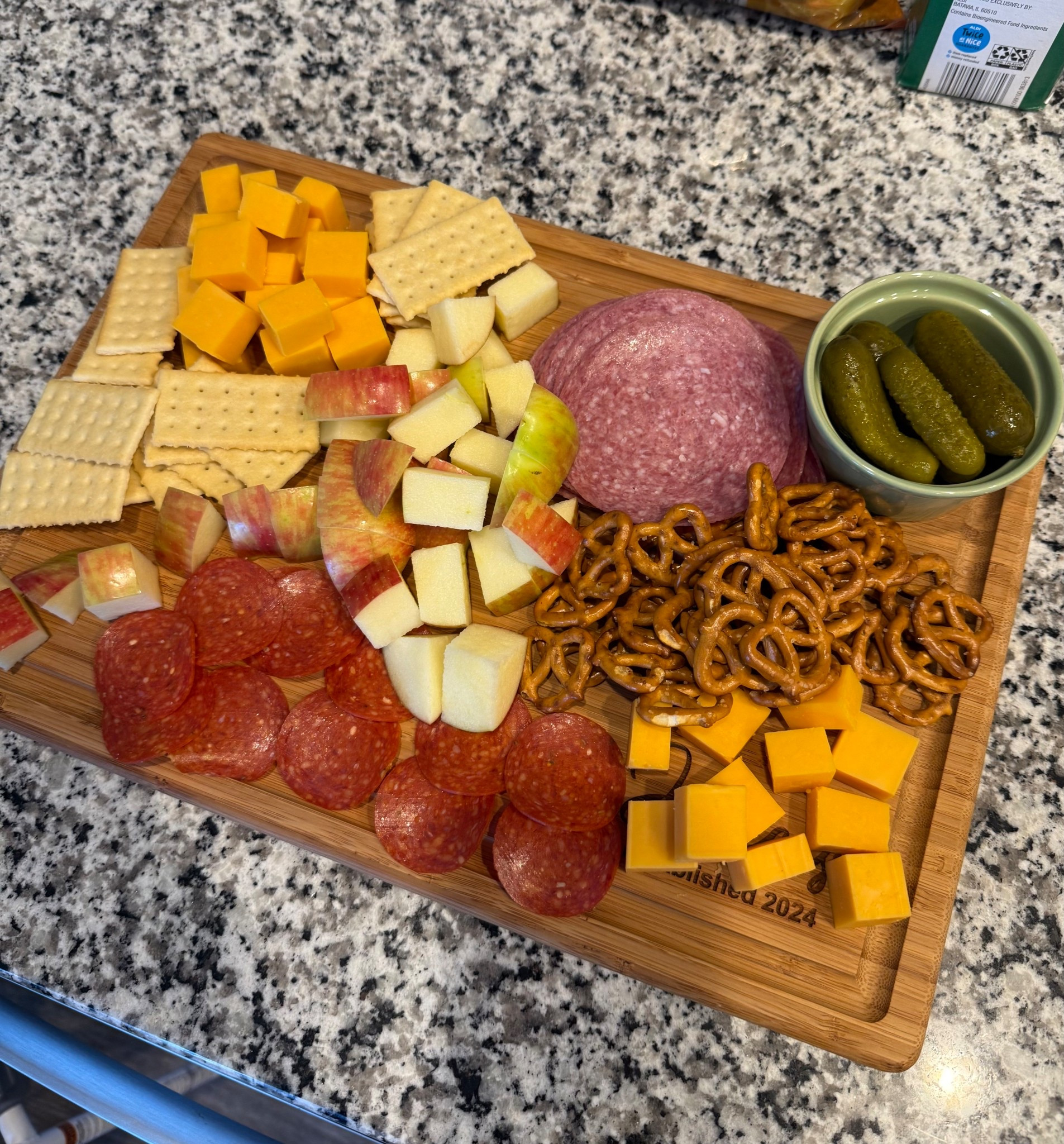 Love love love having friends over to eat and watch football with!! Someone gave us this charcuterie board as a wedding gift, and I think it's so cute and special. Hard to see in this pic, but it says "The Joneses Established 2024"!!! 

 #LTKSeasonal #LTKHome