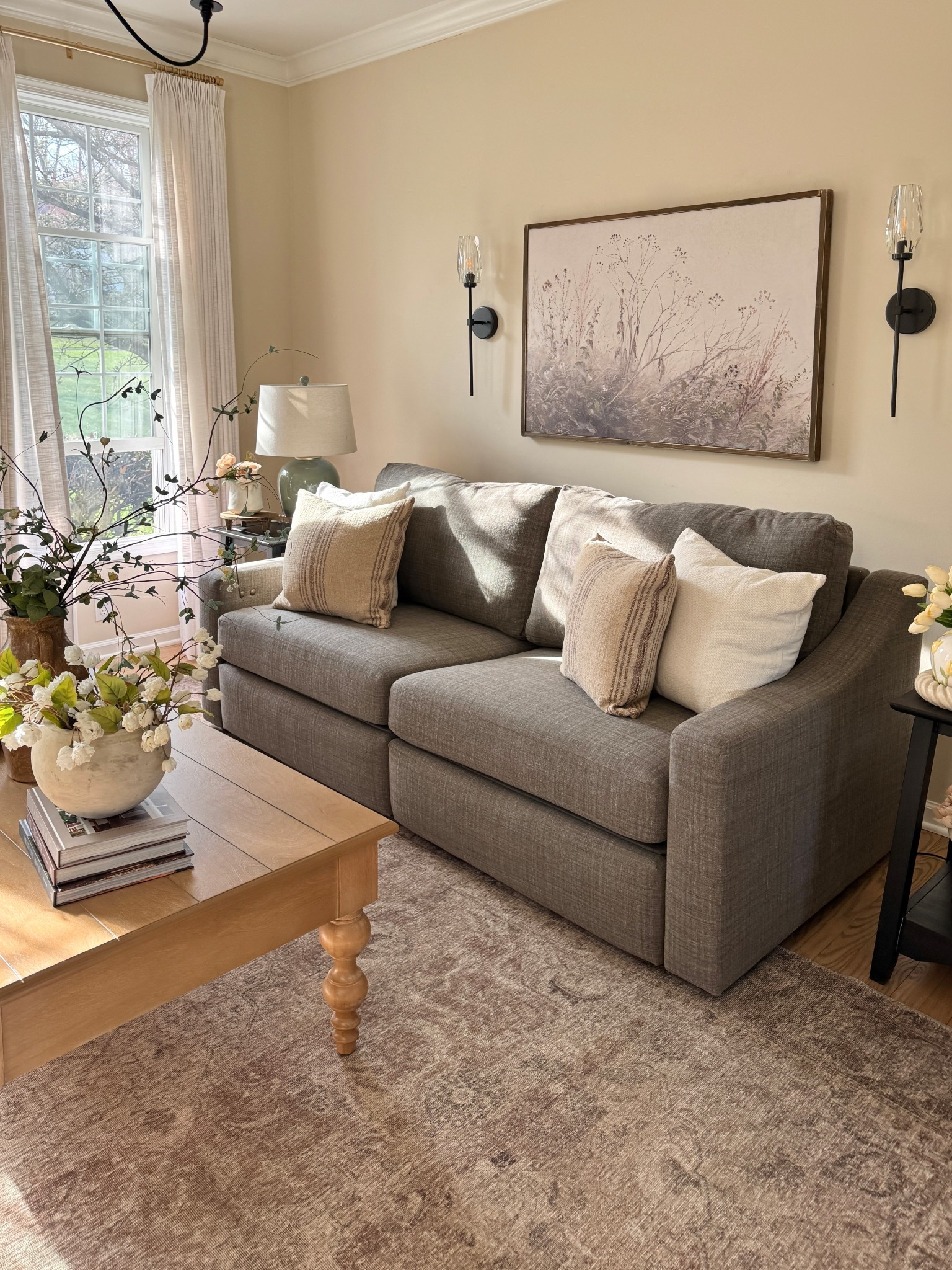 Living room decor:
New coffee table
Solid wood wall art
Wall sconces
Throw pillows
Neutral area rug
Faux florals 
Coffee table books
Custom linen curtains 

Sofa is from Best Home Furnishings (unable to link)


#LTKSaleAlert #LTKHome