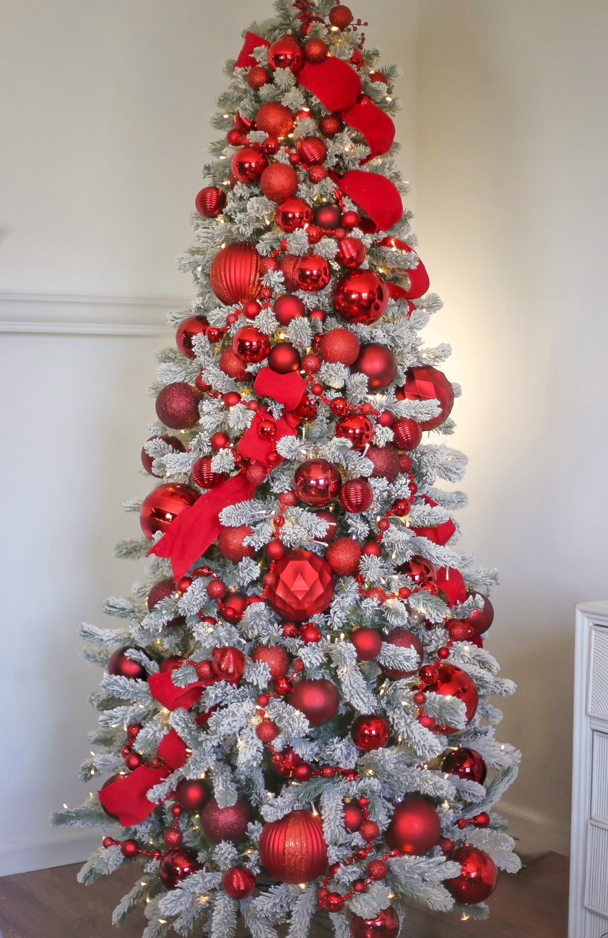 The all red Christmas tree that gets an audible wow every time! ❤️🎄 I used the King of Christmas King Flock Slim Tree as my base—it’s the perfect statement piece if you're wanting that full, luxurious feel.
To bring this monochromatic look to life, I mixed ornaments in varying sizes, tones, and finishes—from high-gloss red balls to matte, velvet, and satin. The key to a visually rich tree is texture. You want the eye to dance across the tree, and that only happens when you layer in different shapes, shine levels, and depths of color.
This bold, cohesive red palette gives the tree a designer feel with a bold edge. It’s festive, timeless, and just a little bit glam.✨

You can find everything I used for this tree at Wayfair. They have a lot of great items right now at great prices, now is the best time to stock up before the dreaded low stock notices start pouring in. 

📌 Save this post for inspo & tap to shop my exact tree and similar ornament styles—perfect for recreating the luxe red Christmas vibe in your own home. ♥️

#LTKSeasonal #LTKxMadewell