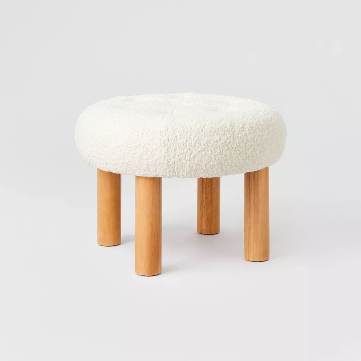 Kessler Round Tufted Faux Shearling Ottoman with Wood Legs Cream - Threshold™ designed with Stu... | Target