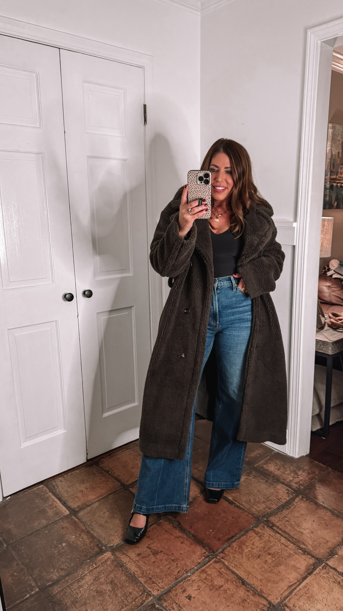 Casual holiday outfit idea

Long Teddy coat is 🌟60% off/$67 🌟
It is so cozy! I am wearing my true size medium 

Skims inspired plunging V-neck top is 🌟on sale 40% off/$20🌟
I am wearing my true size medium. It is so comfy. It feels like second skin. It comes in a few other colors.

Ultra High-rise wide leg jeans are super comfy and flattering with a little bit of stretch. you can dress them up or down. They are my favorite new pair of jeans.
I’m wearing my true size 28

Maryjane’s are super cute & comfy & tts 

#LTKStyleTip #LTKSaleAlert #LTKCyberWeek