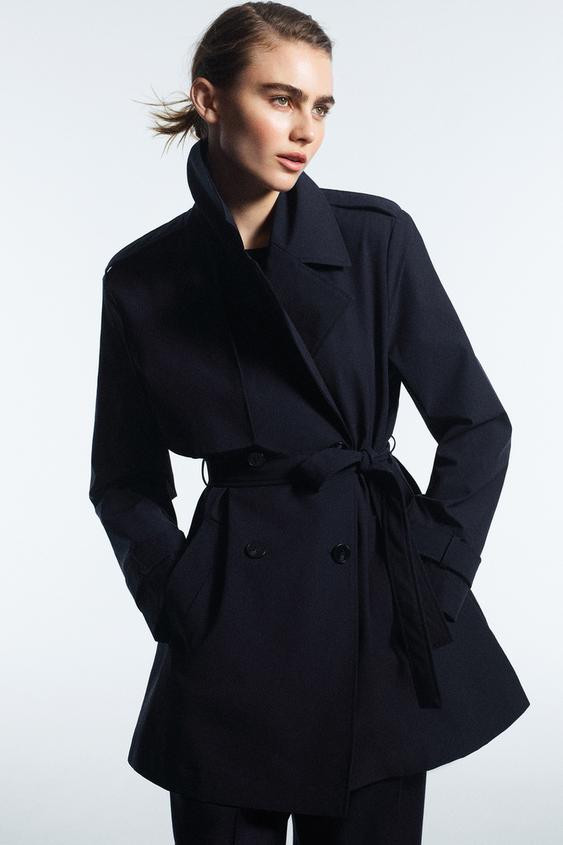Trench coat with lapel collar and long sleeves with belted cuffs. Welt front pockets. Double-brea... | Zara US