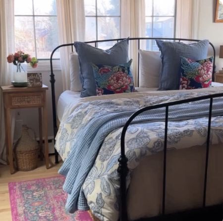 Master Bedroom Spring refresh. Using blues, creams and pinks. Metal bed, rattan shades, linen curtains, waffle weave blanket and floral quilt. 



#LTKhome