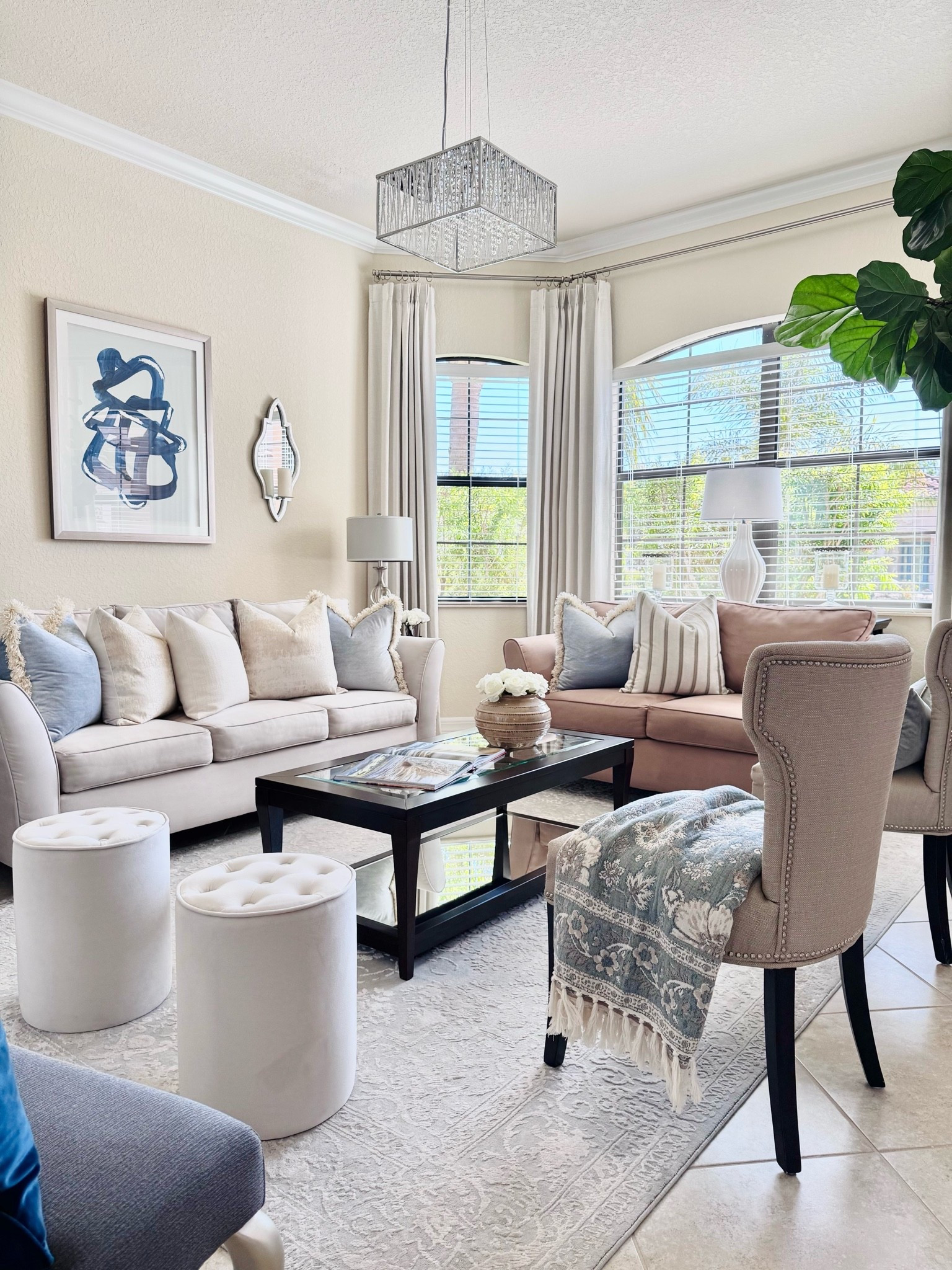 A beautiful blend of warm neutrals, classic blues, and rich wood tones in our formal living room!🩵🤍🤎

Living Room Decor | Timeless Decor | Transitional Decor | Transitional Modern Coastal Decor | 2026
Home Decor Trends

#LTKHome #LTKSeasonal