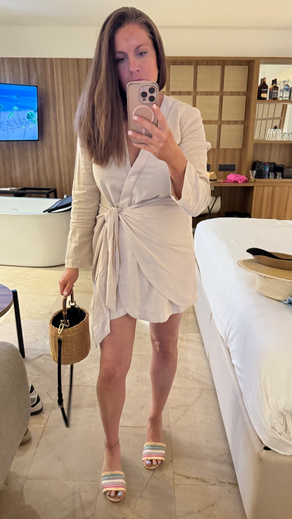 Spring break couples trip all inclusive tropical Caribbean family getaway. Mexico is coming up and this will be in my suitcase. Neutral, long sleeve wrapped dress. Shoes are old crew. Wicker basket handbag  

#LTKOver40 #LTKSeasonal #LTKTravel