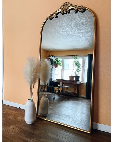 Added a vase and pampas grass to my mirror and I love it! I found the best deal on pampas grass at Hobby Lobby and the white vase from TJ Maxx! Similar styles linked✨

Gold mirror, Anthropologie mirror dupe, Sam’s Club mirror, large mirror, floor length mirror, mirror styling ideas, modern decor, home decor 

#LTKFind
