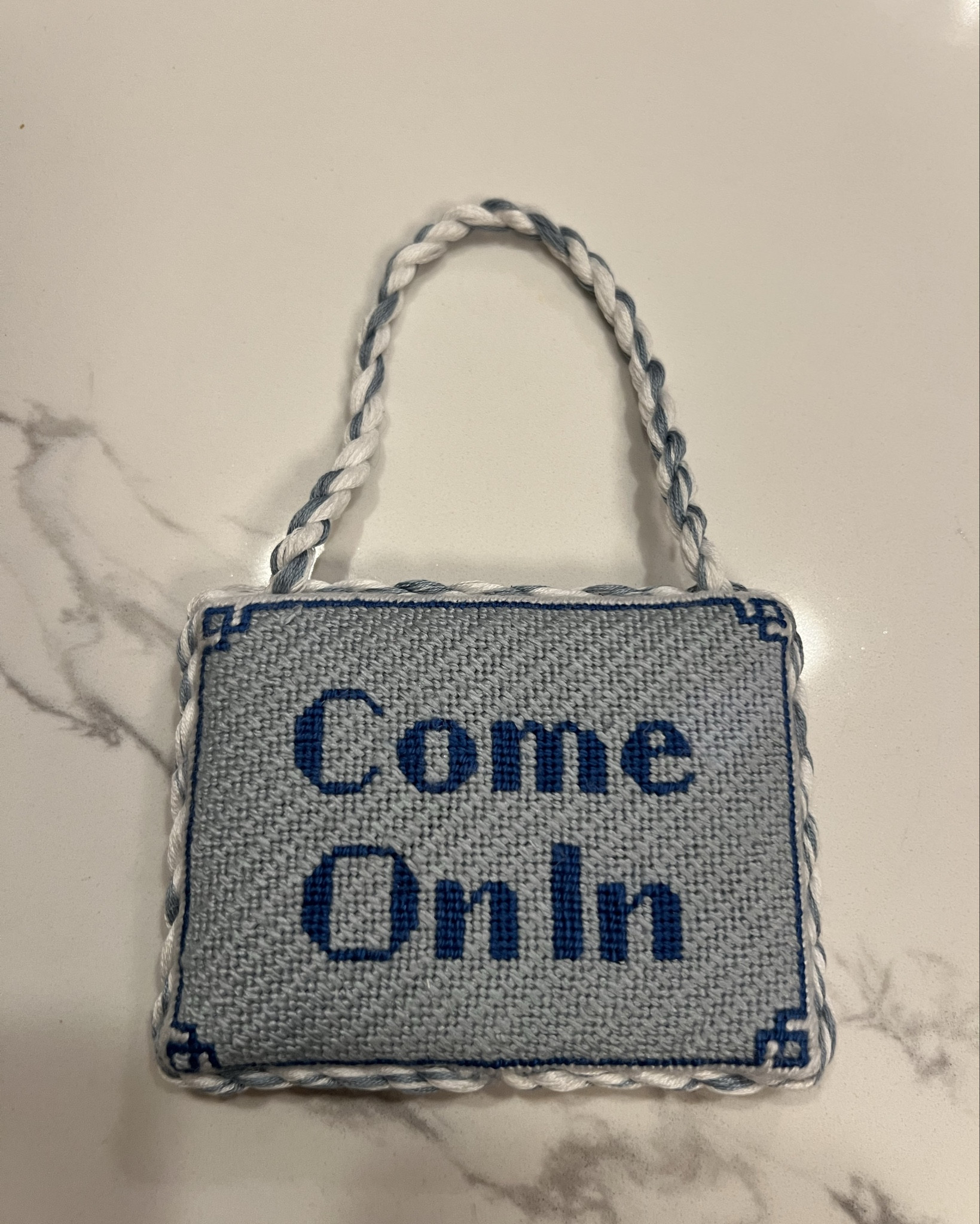 I needlepointed this adorable door hanger for my home office! The canvas is on Etsy and I also found an amazing finisher on Etsy.