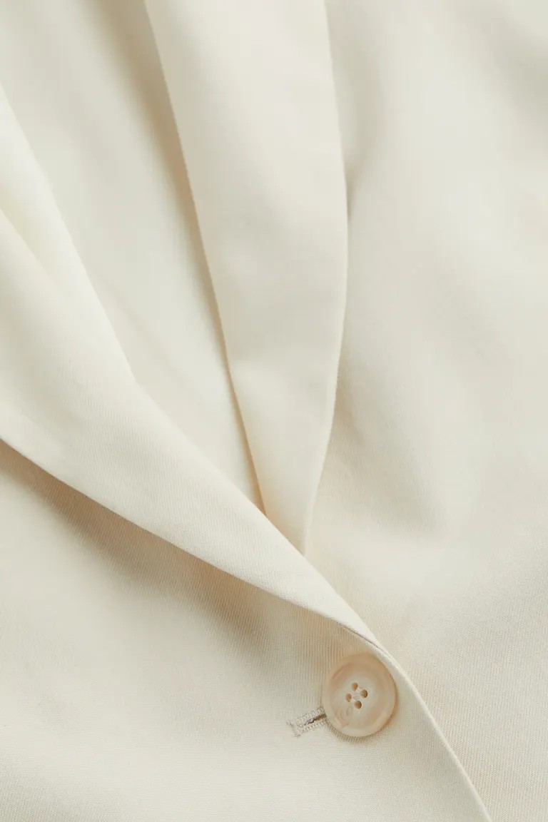 Conscious choice  New ArrivalStraight-cut, single-breasted blazer in a woven lyocell and cotton b... | H&M (US + CA)