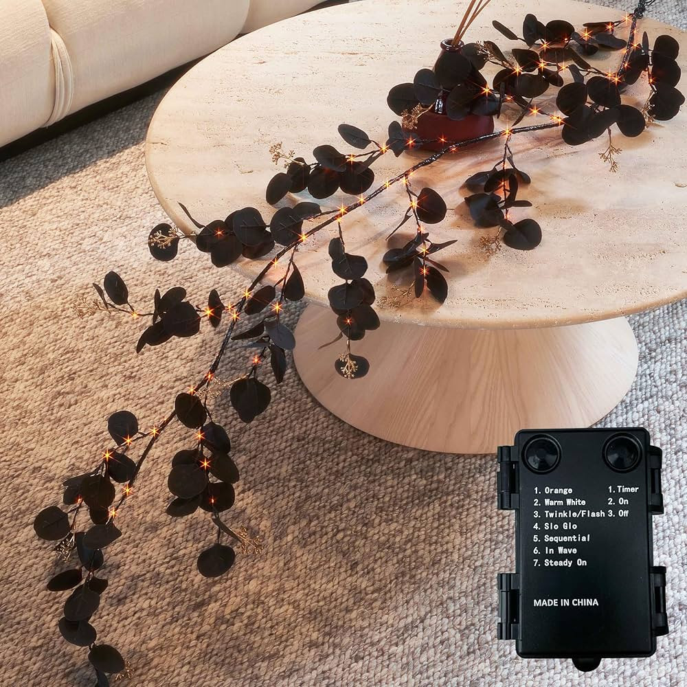 BAOLITVINE Lighted Halloween Black Eucalyptus Garland Battery Operated with 8 Functions 6FT 96 Bi... | Amazon (US)