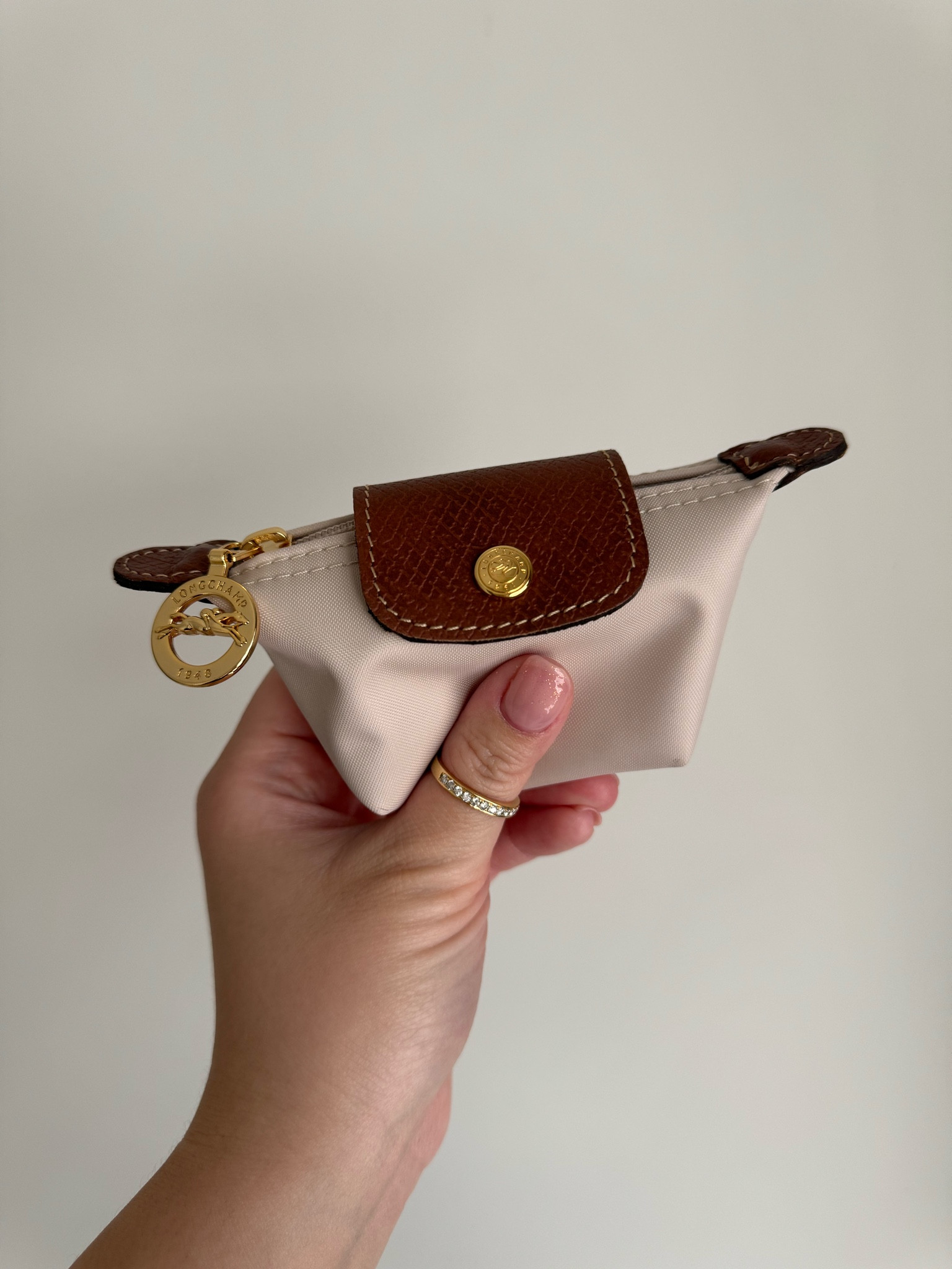 Longchamp coin purse is a must have 

#LTKitbag