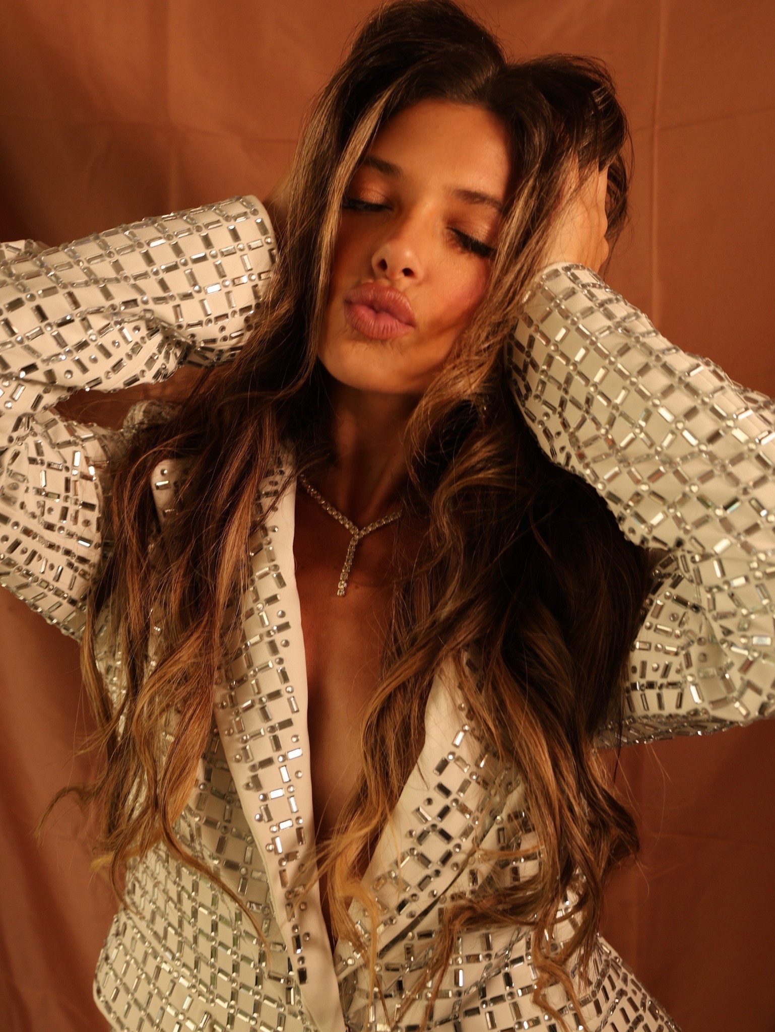 Fall is upon us, which means it’s time to break out those cozy yet fashion statement blazers for work! 

Crafted from luxe satin, this opulent jacket features a plunging neckline, a classic notch lapel collar, padded shoulders, long sleeves, dual waist flap pockets, a single snap-button front closure, and a tonal inner lining. It’s completely adorned in geometric mirrored embellishments. Complete with a structured silhouette. Pair it with the matching AKIRA Label Lila Embellished Mock Neck Mesh Top, Lila Embellished Satin Trouser, and platform pumps for a dazzling finish.

#LTKFallSale #LTKNYFW #LTKSeasonal