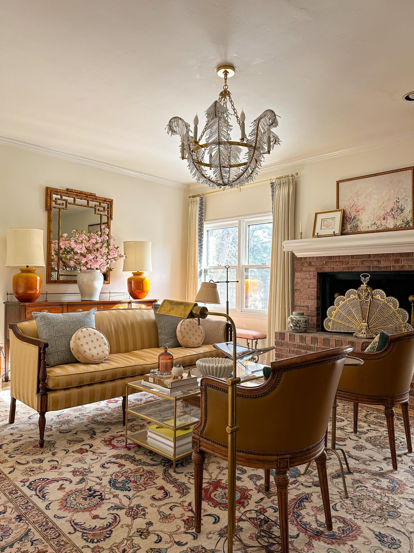 Some pops of pink for Valentine’s Day in one of my most collected spaces.

I knew these pink cherry blossoms would be perfect in this room (I have 12 styled here) and I love how they connect with the pinks in my rug, artwork and bookshelf decor to create a  color thread throughout the space.

The living room is quickly evolving to be one of my favorite rooms, as I think it strikes the perfect balance of old meets new. This room will be on the 2026 project list and I have a feeling it will be my most extensive molding project yet. I’m still in the dreaming phase but I’m fantasizing about some ceiling trim, wall moldings, an extra large ceiling medallion and adding some dentil work to my existing crown molding. Plus a new paint color! 

Should we do this room first?!

#interiordesign #livingroomdecor #collectedhome

I’ve linked everything I could in my ShopMy for you. Comment SHOP and I’ll drop you a link along with a special discount code for the cherry blossoms 🌸