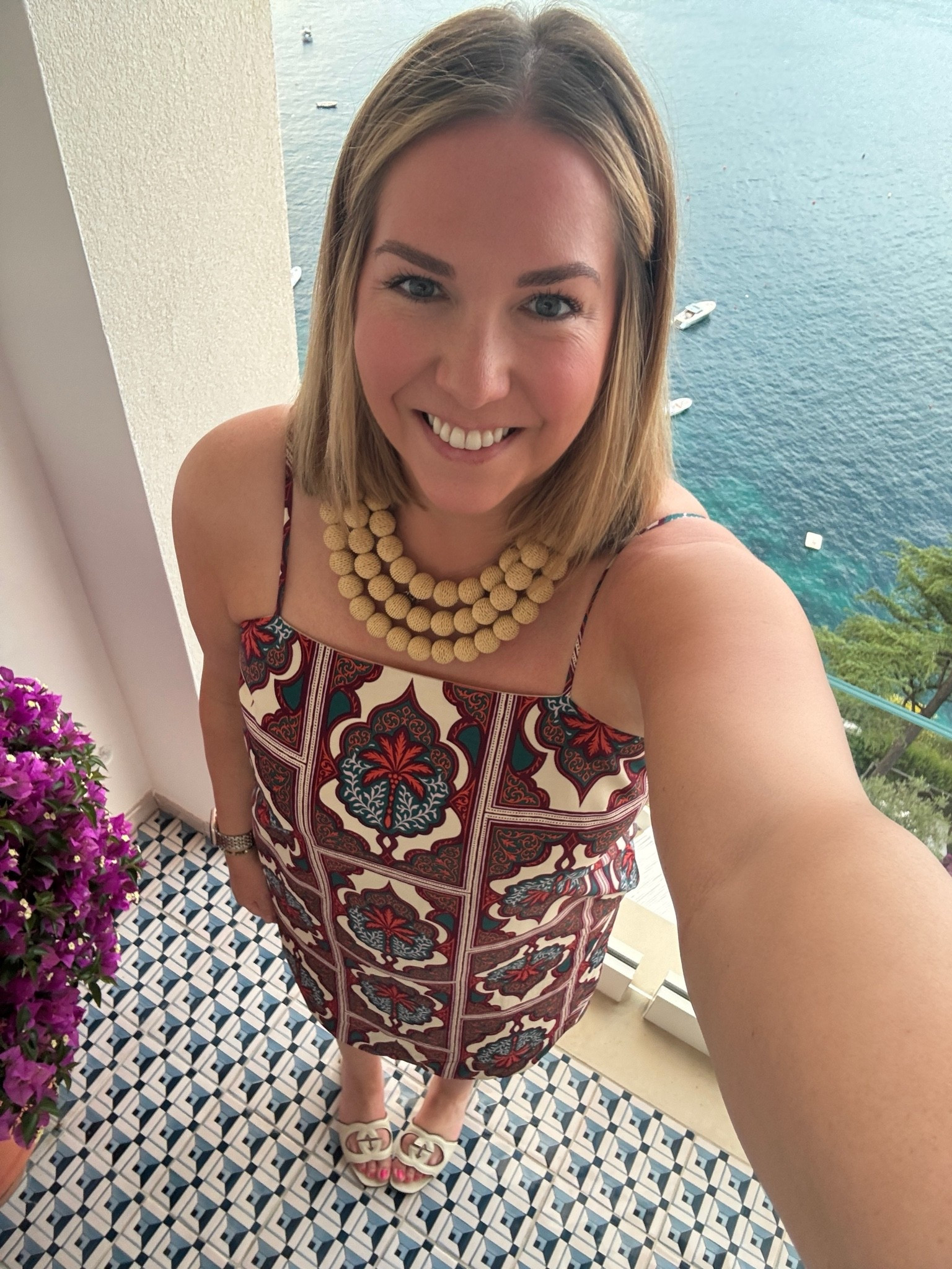 First night in Amalfi and we chose to relax a bit, enjoy our hotel and eat dinner there. It was absolutely incredible. The food this trip has been amazing but it always is in Italy! I loved the colors on this dress and the pattern was so unique. I paired it with this fun raffia necklace and a simple sandal.

#LTKootd #LTKMidsize #LTKTravel