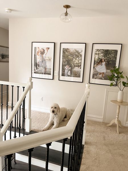Hanging family photos along the wall of a staircase infuses a sense of warmth and personal connection, making a home feel lived in. Each photograph captures cherished memories and tells a unique story, adding a layer of nostalgia and familiarity to the space. This display creates a visual timeline of family milestones, evoking a comforting atmosphere and creating a welcoming ambiance for both residents and guests.

#LTKFind #LTKstyletip #LTKhome