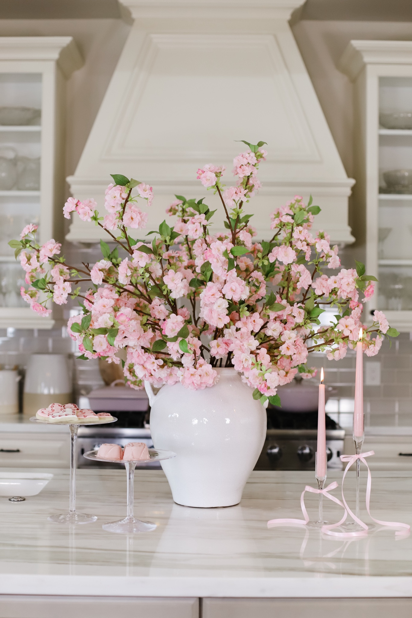 Oh I love being a woman 💗💕Spring / Valentines Day decor in the kitchen! I’ve had these cherry blossoms for a few years now and love how tall and beautiful they are! They really make a statement! Oh!!!! And I found a white vase nearly identical to mine!!!  Linking below! 🌸 



#LTKparties #LTKhome #LTKSeasonal