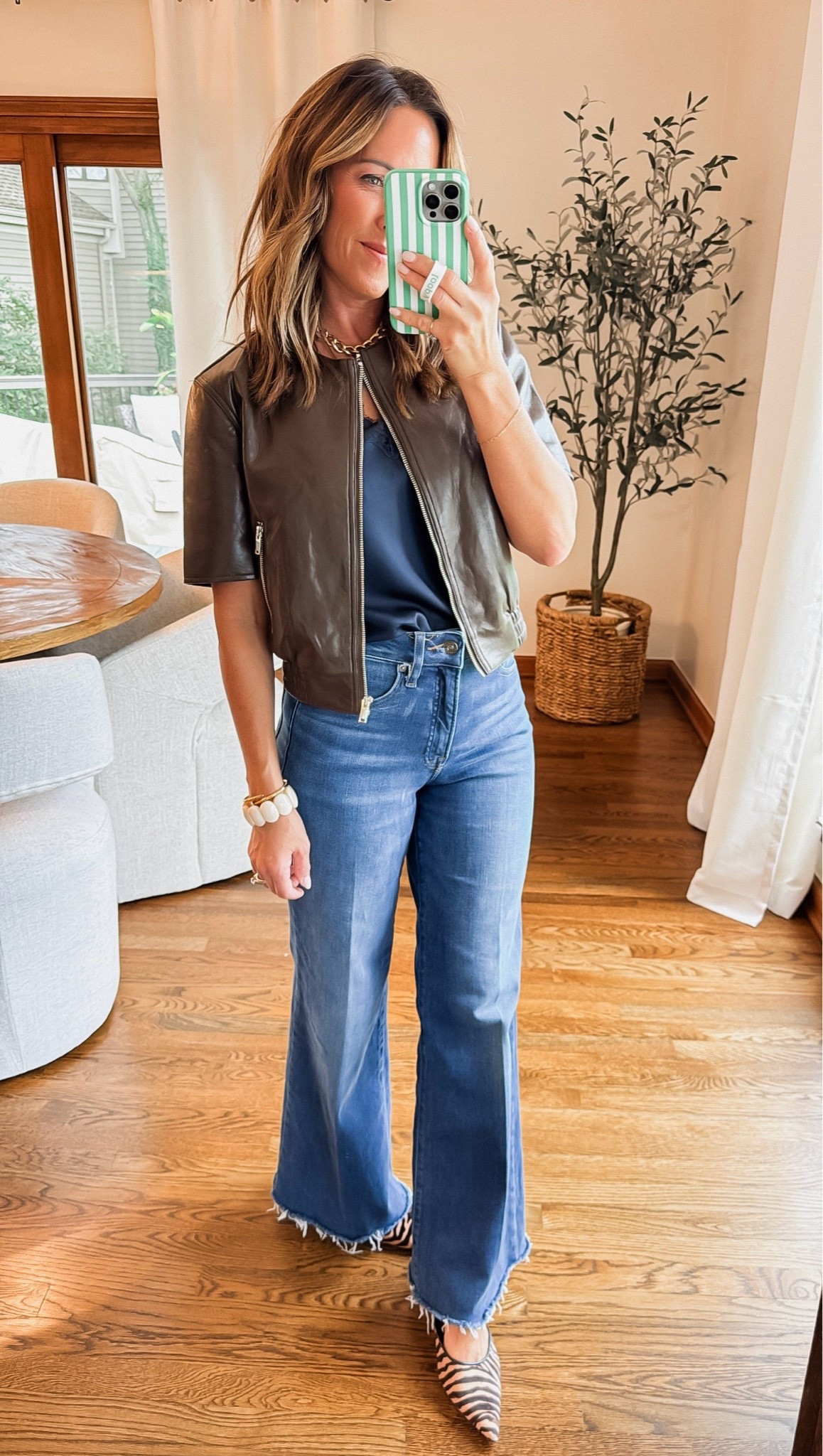 Short sleeve leather jacket. Chic, flattering and in 4 color ways 
Size small here. 
Exact lace cami linked. Navy here - currently sold out but also in black and ivory

#LTKSeasonal #LTKOver40