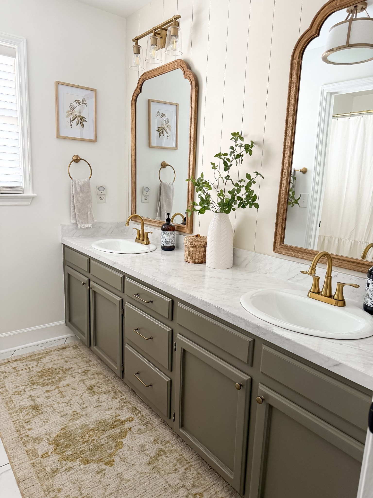 Primary bathroom 

I kept the same layout - even the same cabinets … but with paint, new lights, new hardware and a new floor I was able to transform this bathroom. 

Focal wall: BM White Duck
Vanity: @scnubitup Castlemoss 
Other walls: BM Chantilly Lace 

#LTKHome #LTKStyleTip