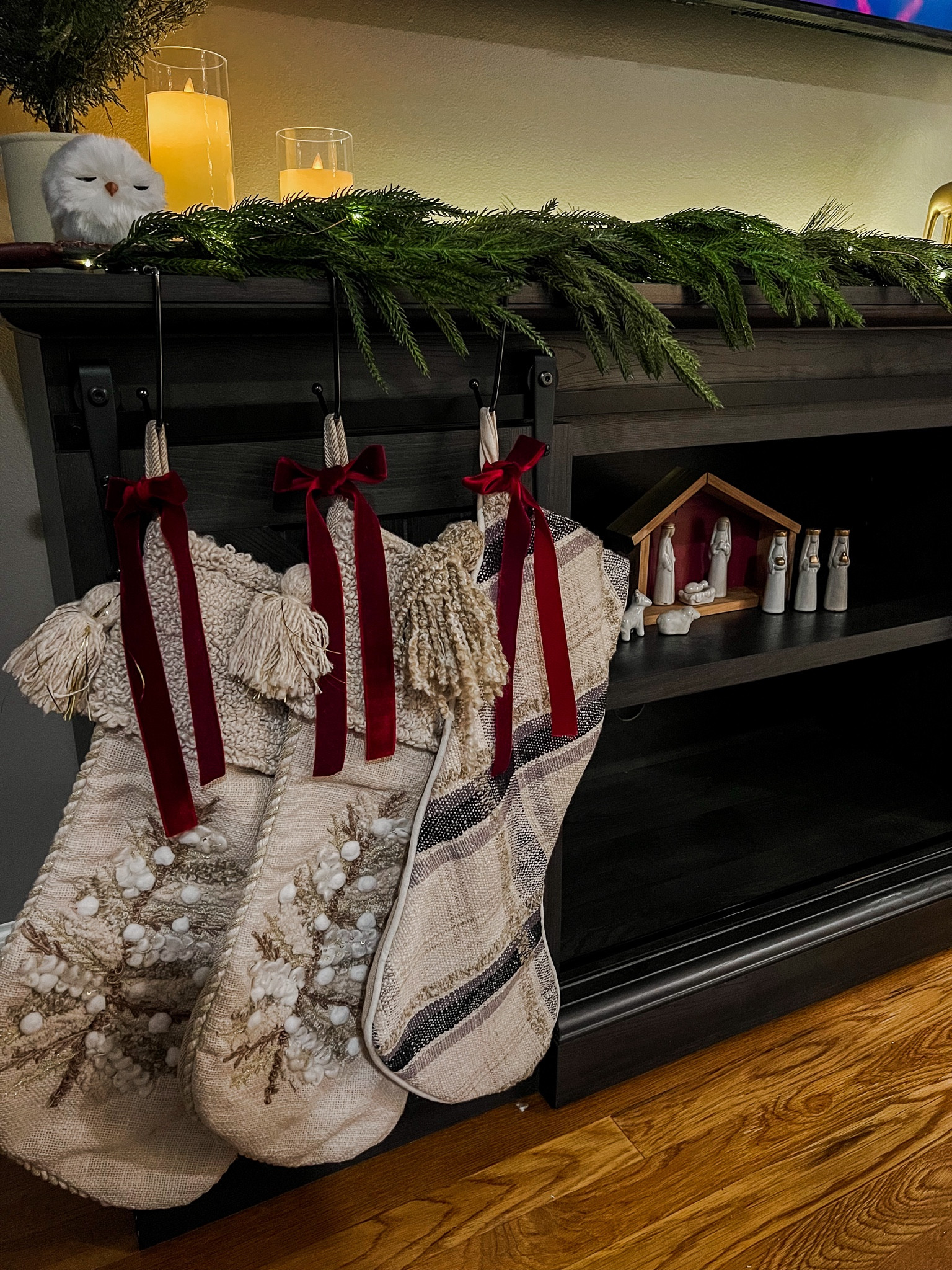 Neutral and modern Tv stand Christmas decor 🎄

Christmas mantle, Christmas shelf styling, stockings, Norfolk garland, nativity set, battery candles, Christmas ribbon 

#LTKHoliday #LTKSeasonal #LTKhome