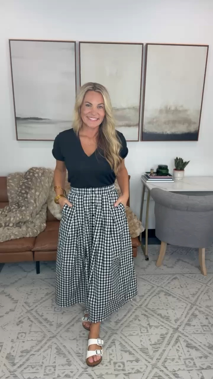 Gingham is such an easy way to bring print into an everyday outfit. I paired this full midi skirt with a simple black tee and flat sandals for a look that works for the office, lunch, or weekend plans.

gingham skirt, midi skirt, black and white outfit, fall transition outfit, casual workwear, office outfit, midi skirt outfit, everyday style, gingham outfit, womens fall fashion, AudrieDollins

#LTKootd #LTKSeasonal #LTKOver40