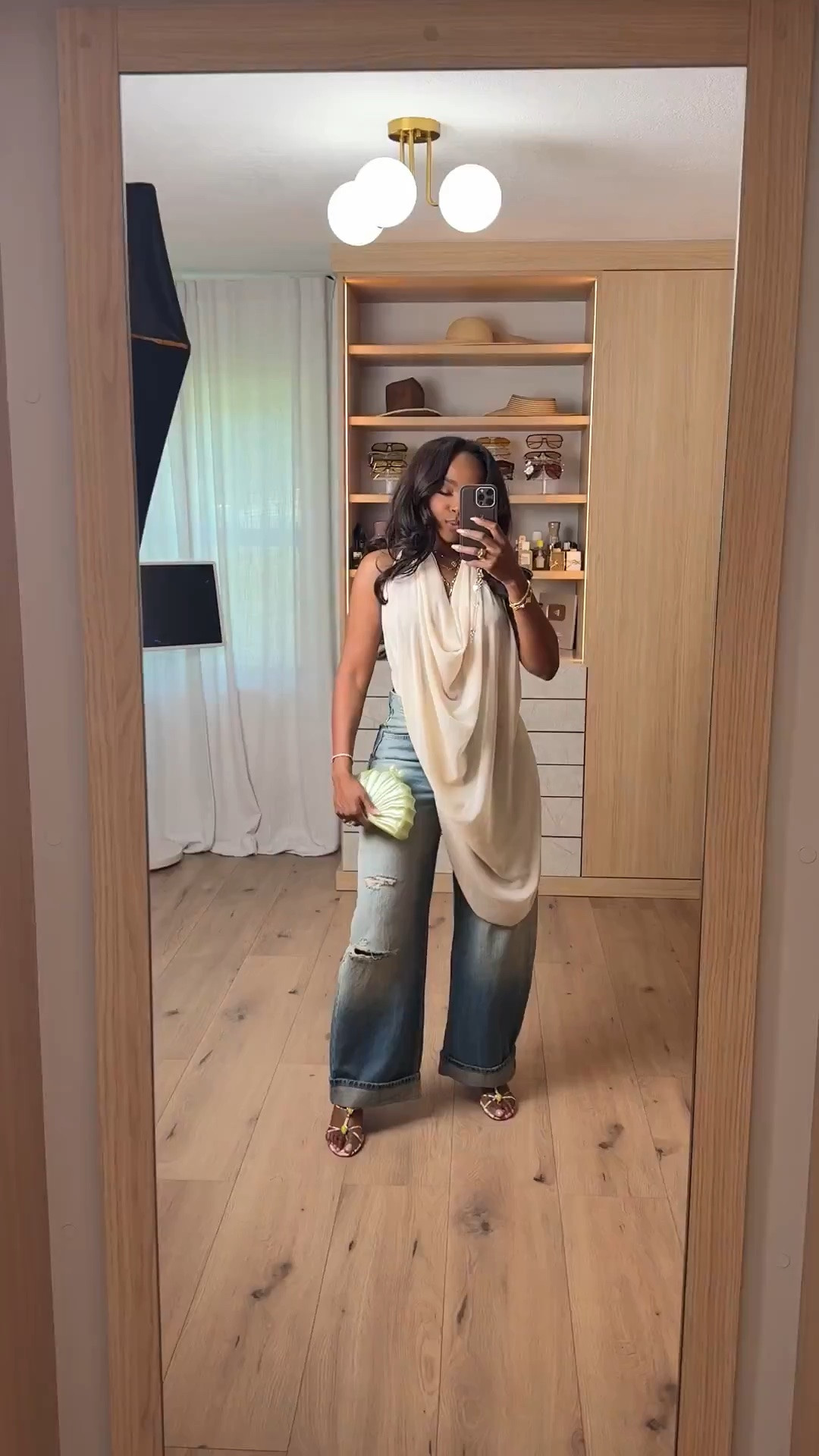 Hi Babes!

This outfit is the perfect mix of relaxed and elevated 🤍 The draped asymmetrical top instantly gives this look a designer-inspired feel, while the distressed wide-leg denim keeps it casual and effortless. I love how the soft neutral tones paired with the textured clutch create that chic vacation-ready aesthetic without feeling overdone.

This is one of those looks that feels fashion-forward but is still incredibly wearable. Each piece can be styled separately, making it a great long-term wardrobe investment with endless outfit possibilities.

Perfect for:
• Vacation dinners
• Resort wear
• Brunch with friends
• Girls trips
• Summer date nights
• Weekend outings
• Coastal getaways

Everything is linked below 🤍

xx Kira | IG: KirasFashionFinds

34D - 27 - 40 • Size Small or 4

#LTKgrwm #LTKootd #LTKPetite
