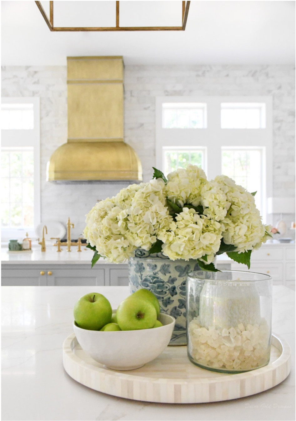 Kitchen round decorative tray
Kitchen styling pieces
Blue and white planter, candle, bowl
Brass faucet, pot filler


#LTKhome