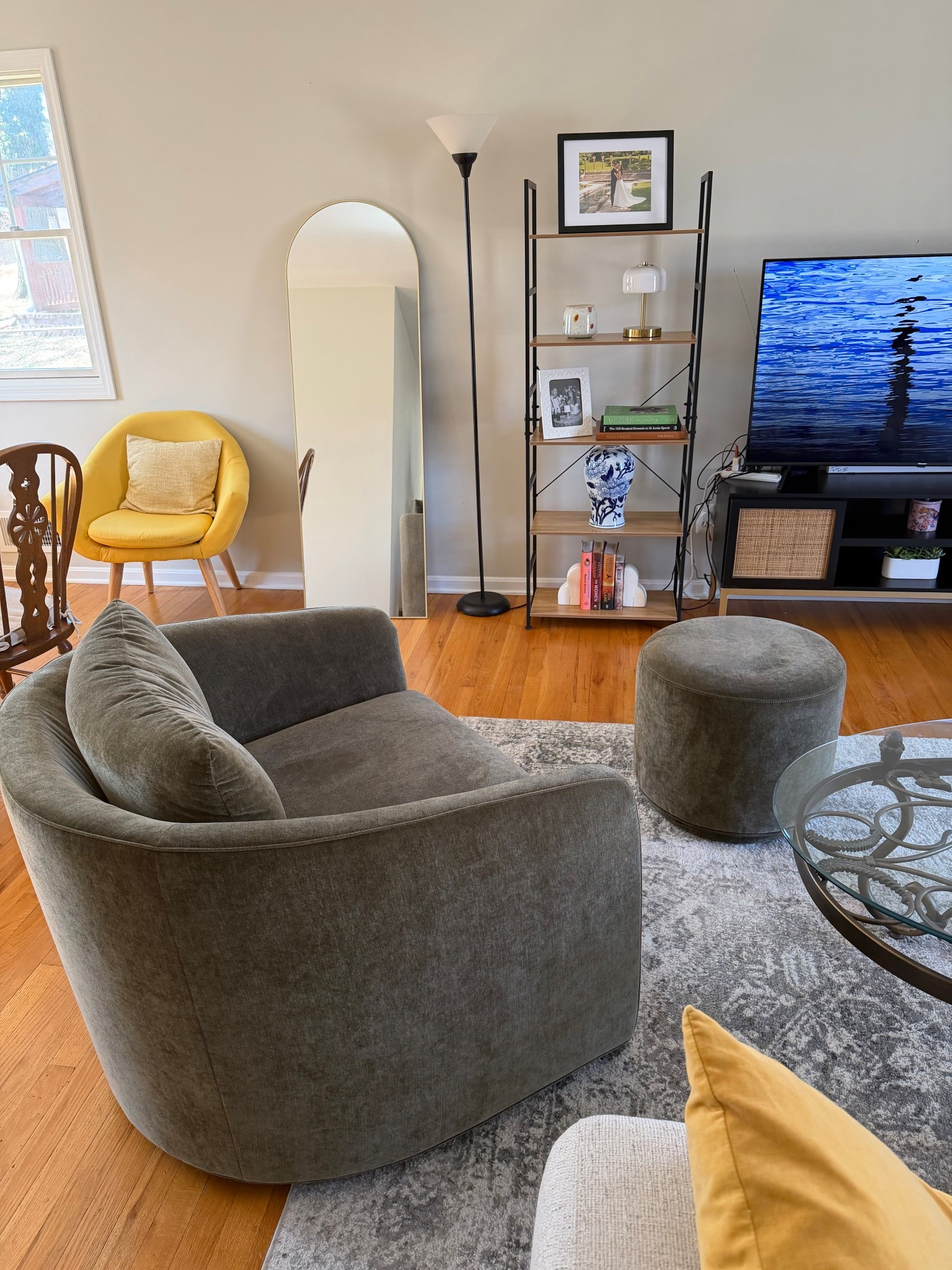 Recently added this beautiful swivel chair and foot stool to our living room! It looks fabulous. It is the larger size and it is from Pottery Barnn