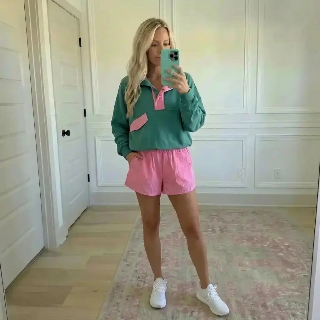 Soft morning light spills across a calm, neutral room as she catches her reflection mid-stride. A sea-glass green pullover with playful pink accents meets airy blush shorts—easy, nostalgic, and effortlessly cool. It’s the kind of outfit that feels like spring before spring arrives: casual sneakers, relaxed confidence, and a palette that feels fresh, feminine, and a little preppy. Cozy meets sporty in a look made for errands, coffee runs, or chasing sunshine wherever the day leads.

Hashtags 🌸👟

#TrendyHeidi
#TrendyWithAPassport
#AthleisureStyle
#CasualChic
#SpringVibes
#EverydayOutfit
#SportyStyle
#WeekendWear
#ComfortAndStyle
#PreppyCasual
#OOTD
#LookForLess
#EffortlessStyle
#SoftColorPalette
#MomStyle
#ActivewearInspired
#LifestyleBlogger
#NeutralHome
#SneakerStyle
#PinkAndGreen
#CozyCool
#ModernCasual
#WomenOwnedBrand
#StyleInspo
#EverydayFashion

If you want, I can also do:

#LTKgrwm #LTKdayinmylife #LTKValentine