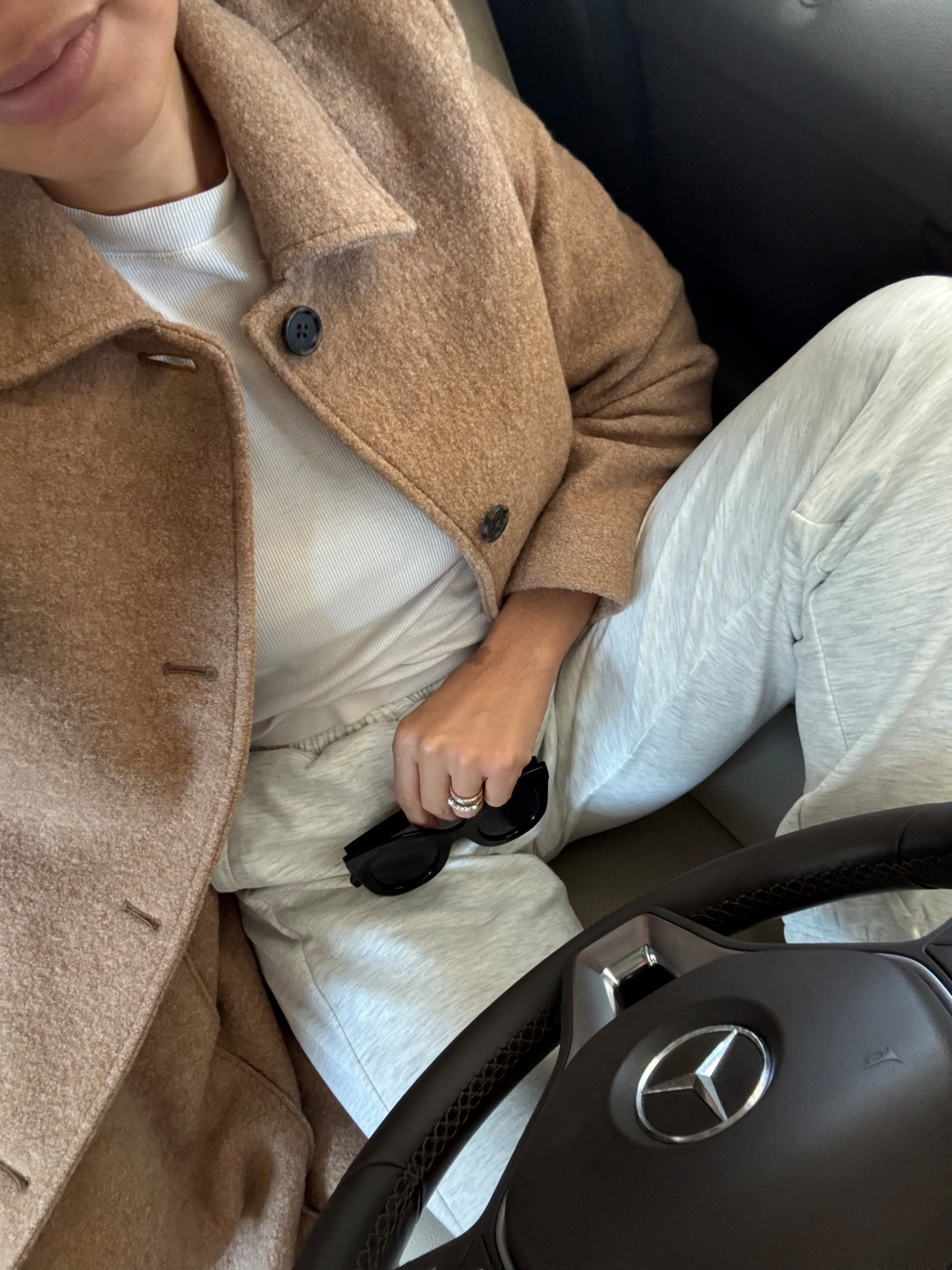 Elevated casual outfit with joggers, sneakers, sunglasses, a white t-shirt, and a wool coat 

#LTKStyleTip #LTKootd