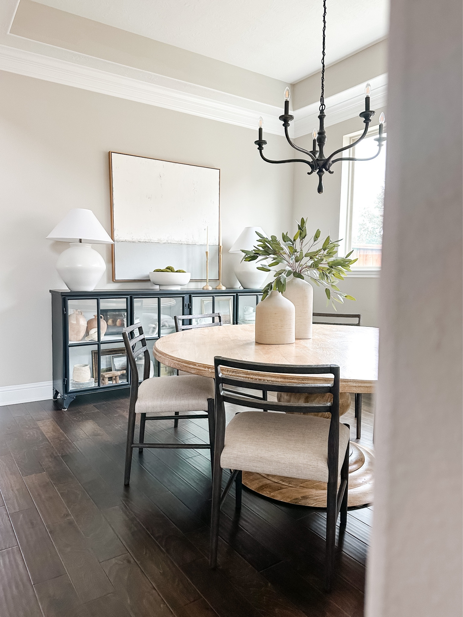 Dining room view of my house because you love this space!  FYI my dining room chairs are on sale at pottery barn!!my round dining table is from Kathy kou home and my sideboard is sold by multiple retailers. My art can be found on Etsy, and I also linked the home decor accessories too. 

#LTKSeasonal #LTKhome #LTKstyletip