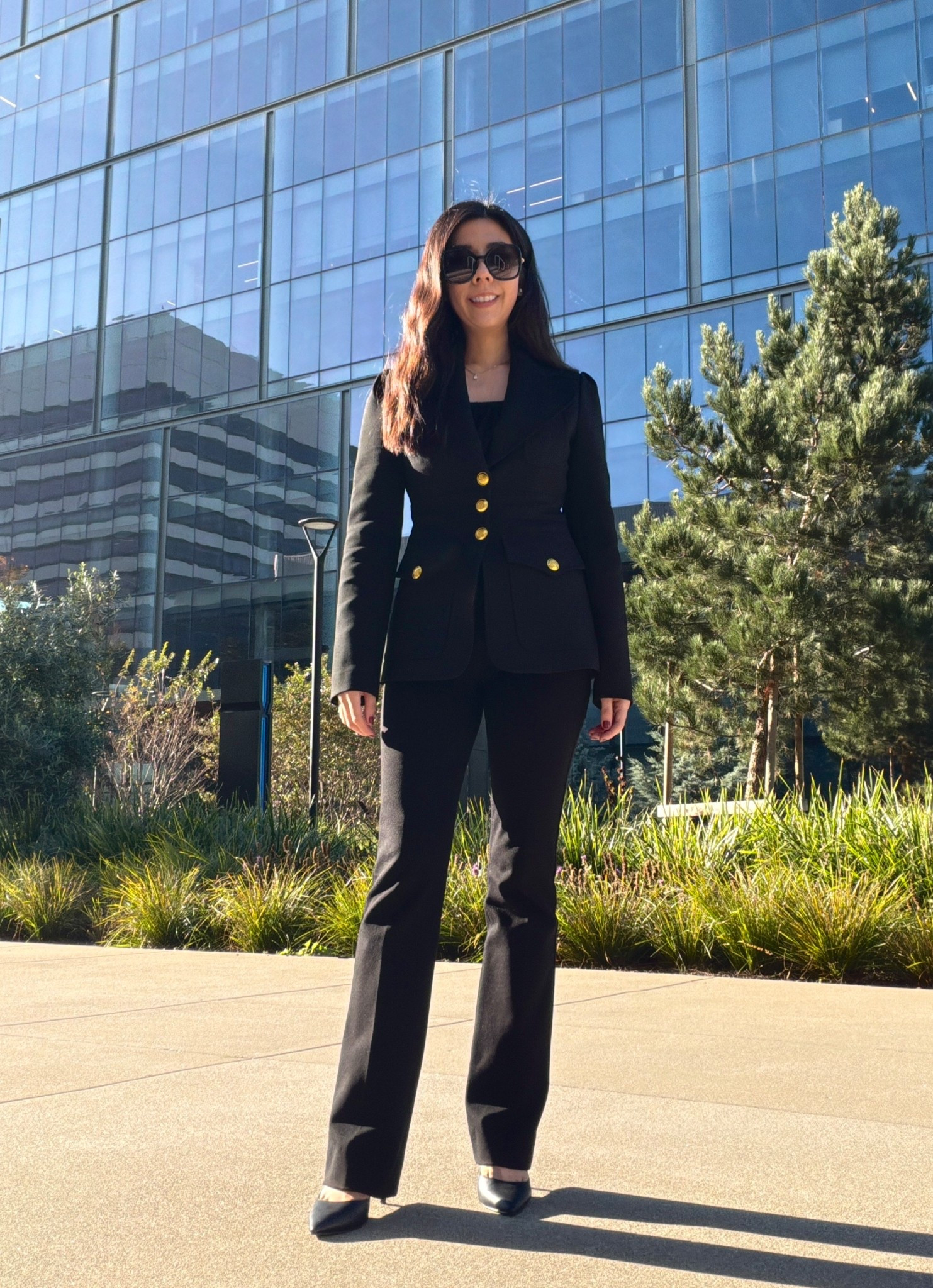 A black power suit is always a good idea when you have nothing to wear. I love this A.L.C. Blazer since it cinches my waist and has gold buttons that line the front of this piece and along the sleeves. It adds a little more depth and character to an otherwise muted look. 

#businesscasual #corporatestyle #allblackoutfit #9to5style 

#LTKPetite #LTKWorkwear #LTKootd