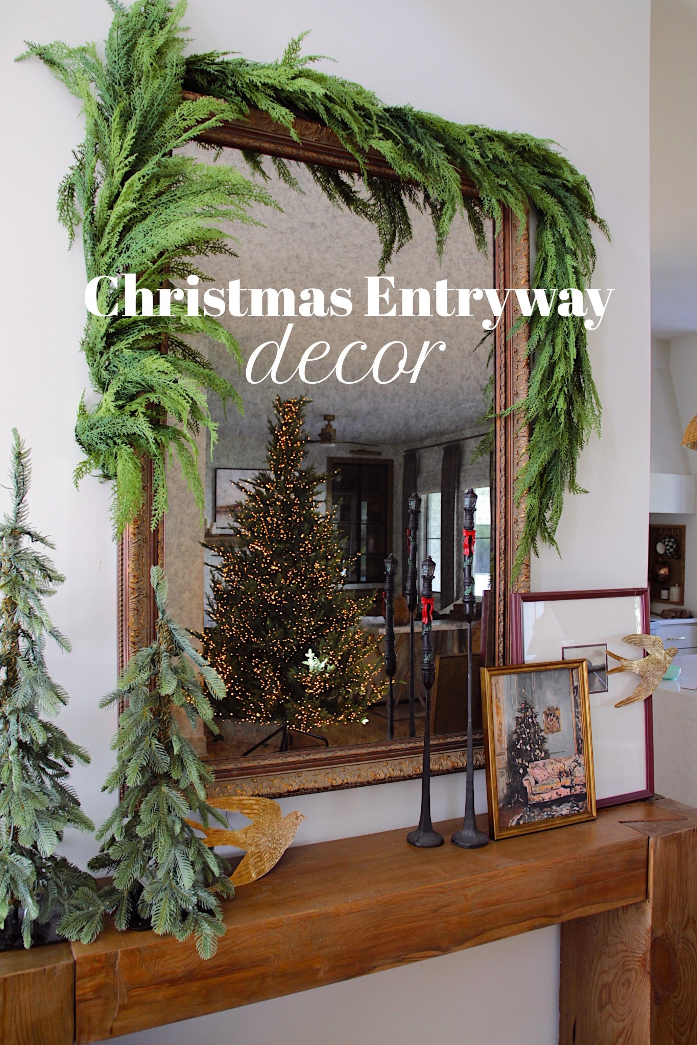 Christmas entryway inspiration for this holiday season! Add a thick garland, some faux cedar trees, and some beautiful Christmas art! 

#LTKHome #LTKSeasonal #LTKStyleTip