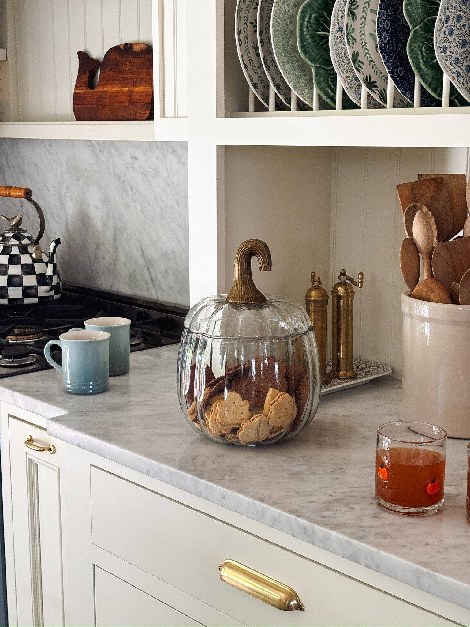 Pumpkin terrarium, blue mugs, pumpkin glasses, black and white checkered kettle

#LTKSaleAlert #LTKHome #LTKSeasonal