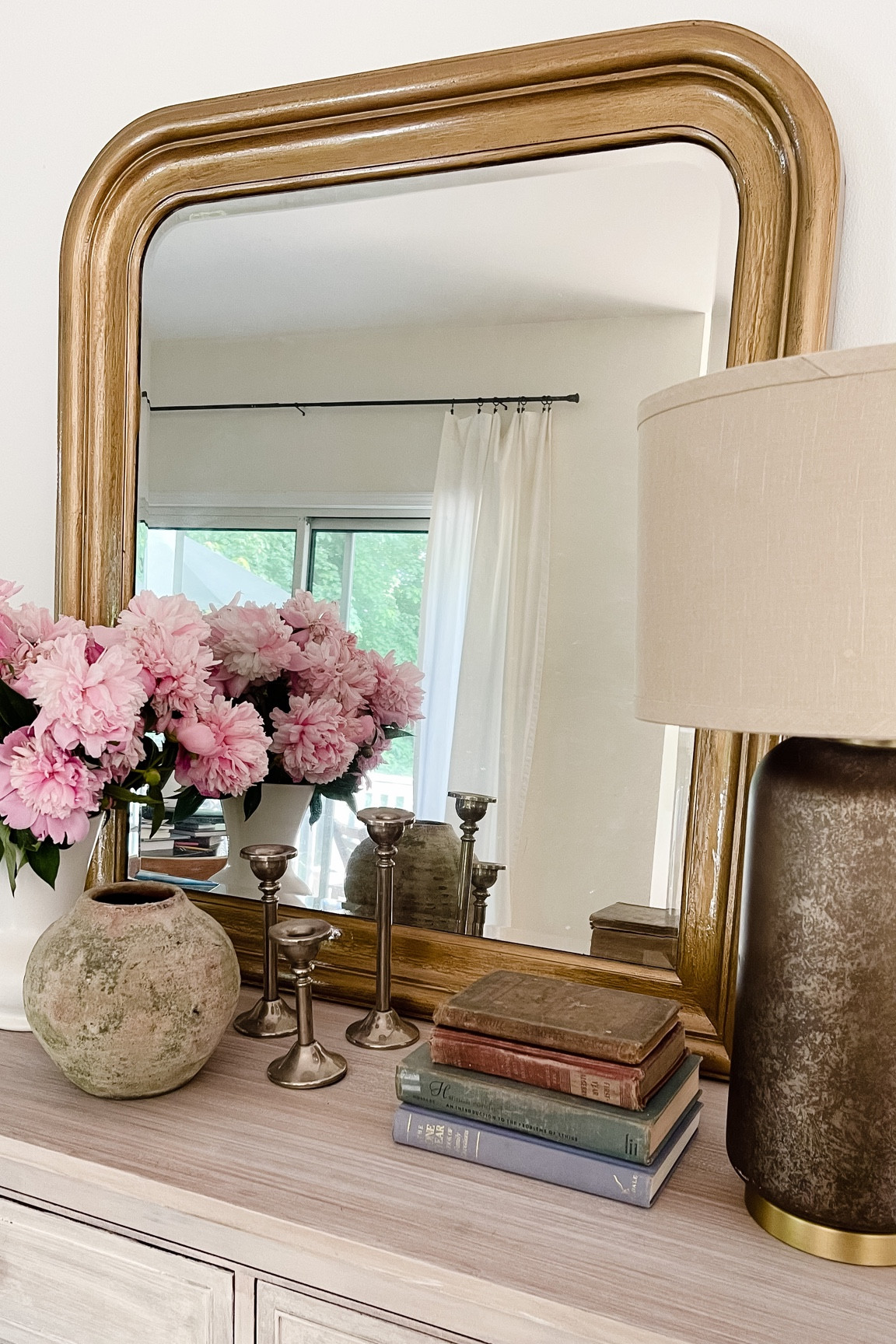 Arched mirror, gold arched mirror, gold mirror, vintage mirror.

#LTKhome #LTKFind #LTKstyletip