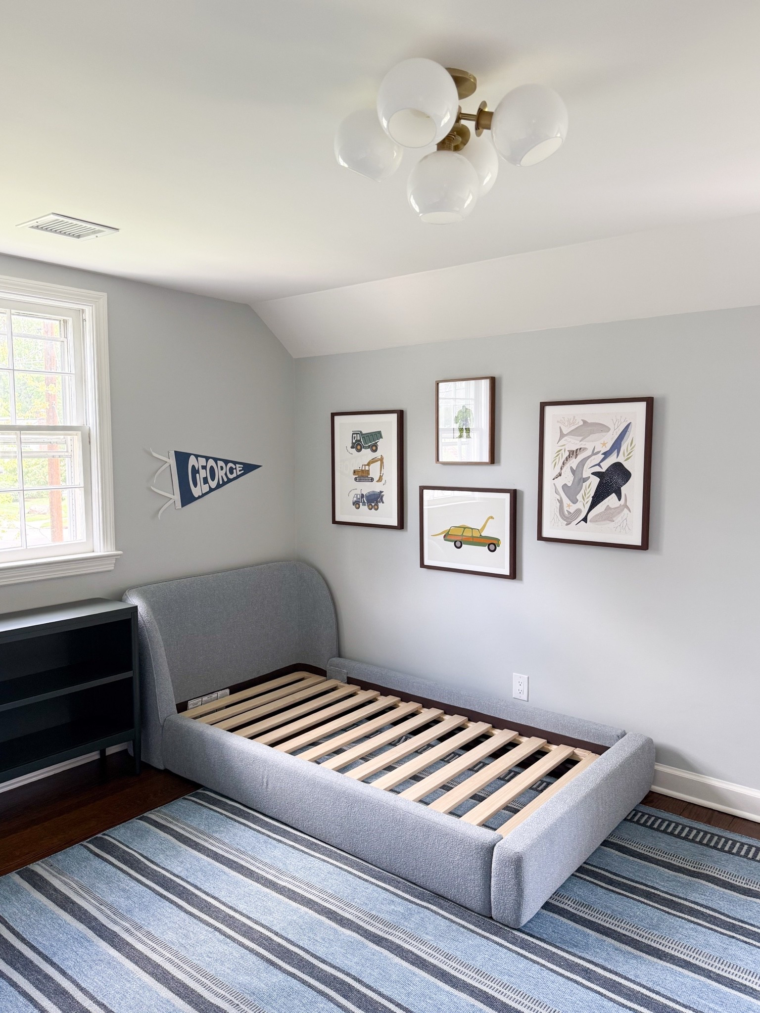 Working on a shared boys’ bedroom that’s going to be SO CUTE when I’m done with it!! Making a conscious attempt to share more of a look behind the scenes and the progress of rooms as they unfold (because things don’t happen overnight!) 

Gallery wall, kids bedroom, kids room, boys room, playroom inspo, bedroom inspo, striped rug, cozy bed, statement lighting, modern coastal

#LTKKids #LTKHome #LTKmomlife