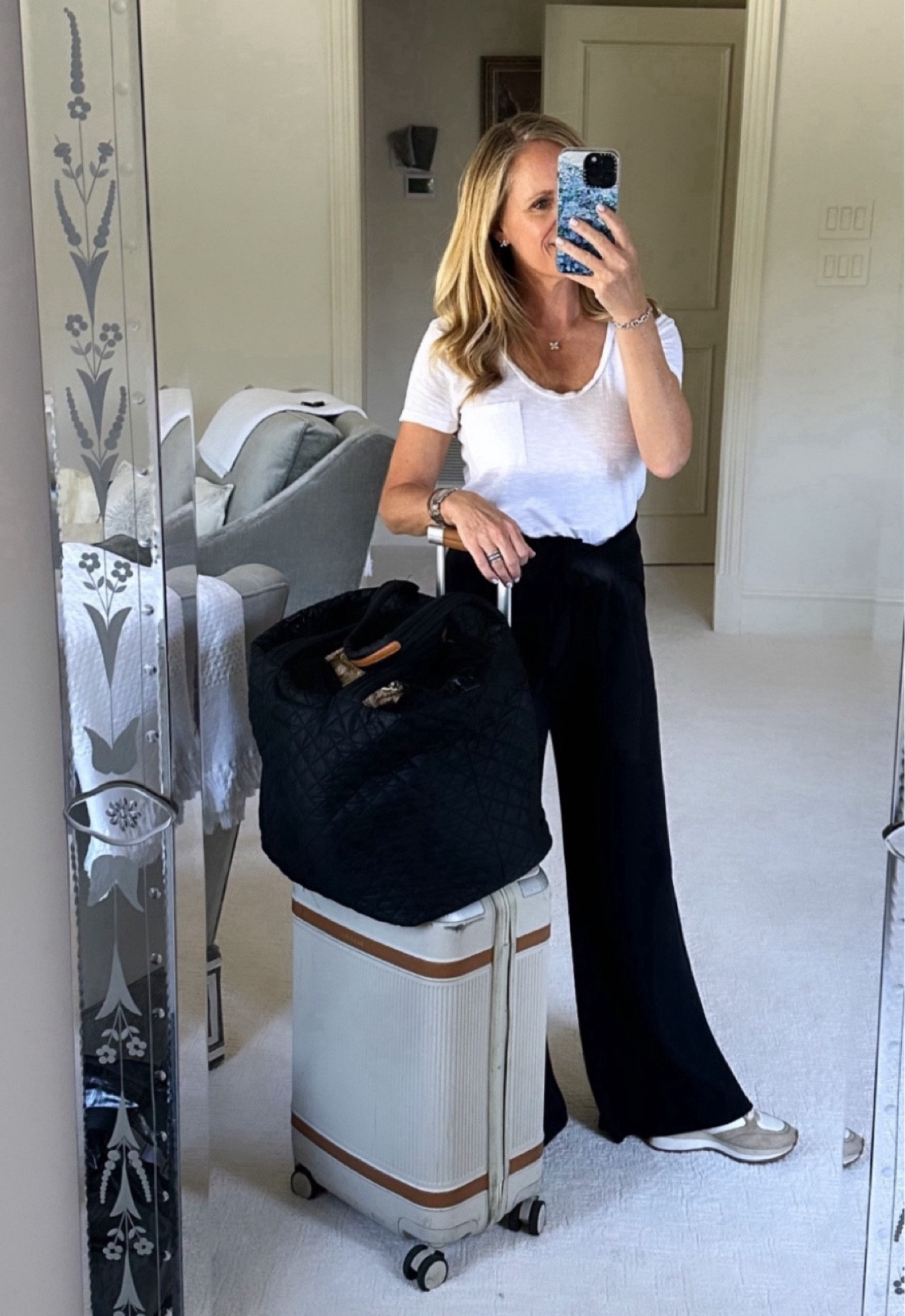 All my travel favorites are going to here!
I love traveling in the Spanx AirEssentials wide leg cropped pants. I am wearing extra small petite and I’m 5‘2“ tall for length reference. 
This thanks Spanx AirEssentials half zip is tied around my waist for when it gets cold on the plane
This is my favorite carry-on suitcase, the Paravel aviator plus 
Best carry-on, travel, tote, MZ, Wallace metro tote 
My favorite packing cubes travel curling iron steamer 

#LTKTravel #LTKOver40 #LTKSeasonal