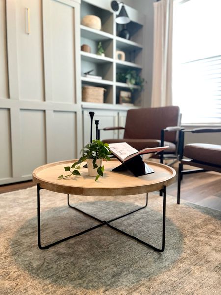 Shop my office coffee table set up 
- affordable west elm coffee table 36” diameter 
- acrylic book stand 
- faux greenery
-candle sticks 

#LTKstyletip #LTKhome #LTKunder50