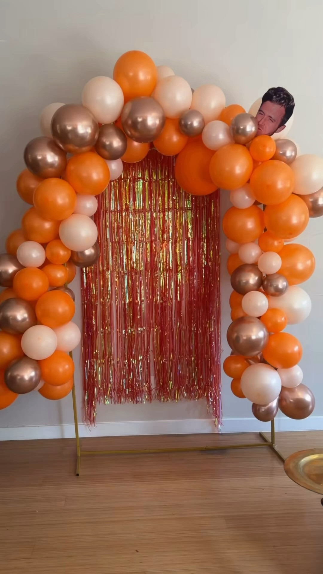 Orange garland balloon arch from Amazon for hosting. DIY balloon arch. Balloon pump. Hosting at home. Bachelorette party