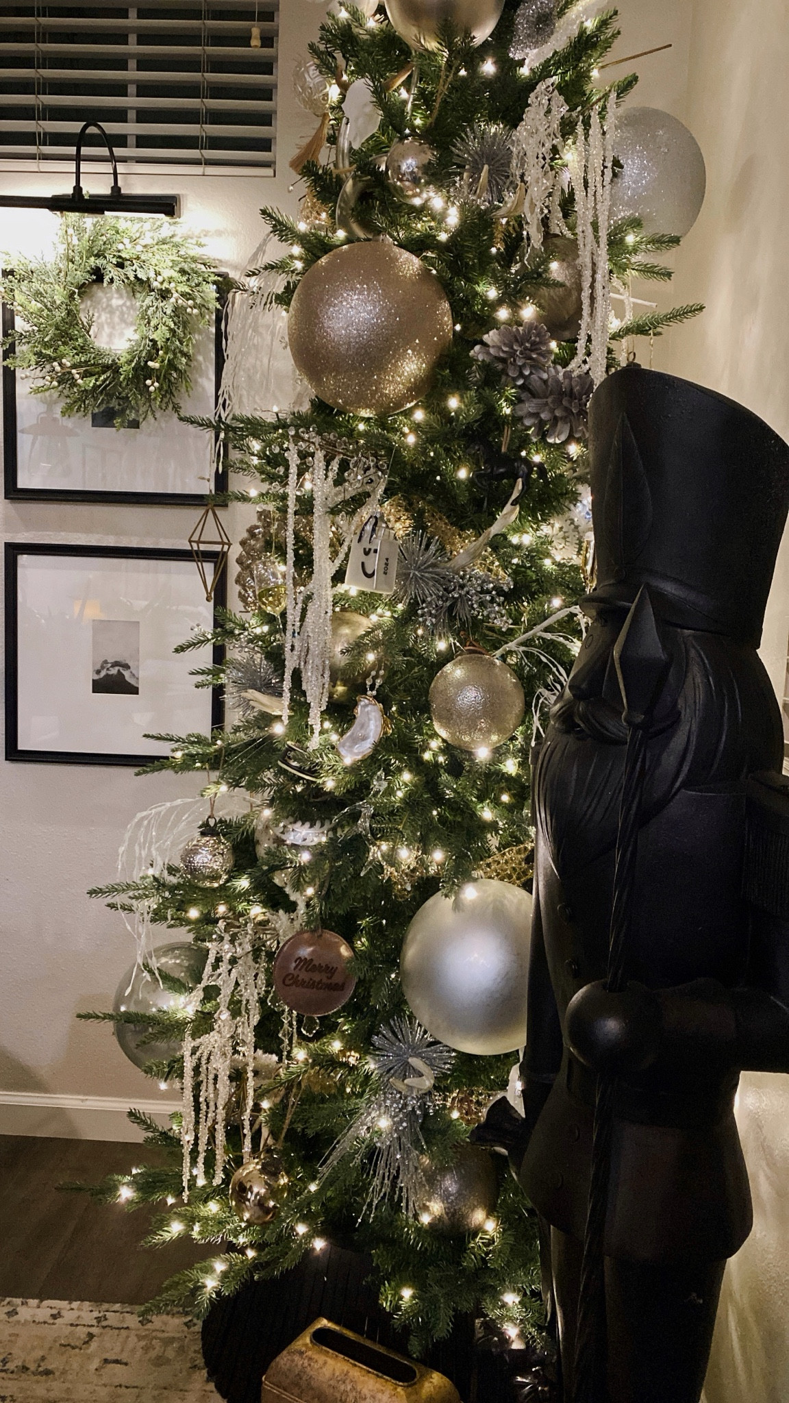 The viral Home Depot tree is viral for a reason ✨ Year two and I’m obsessed 🌲🧑🏼‍🎄 Giant nutcracker is from HomeGoods & I spray painted it! Mini wreaths are Hobby Lobby, any non-linked ornaments or filler are Hobby Lobby or local boutiques. 